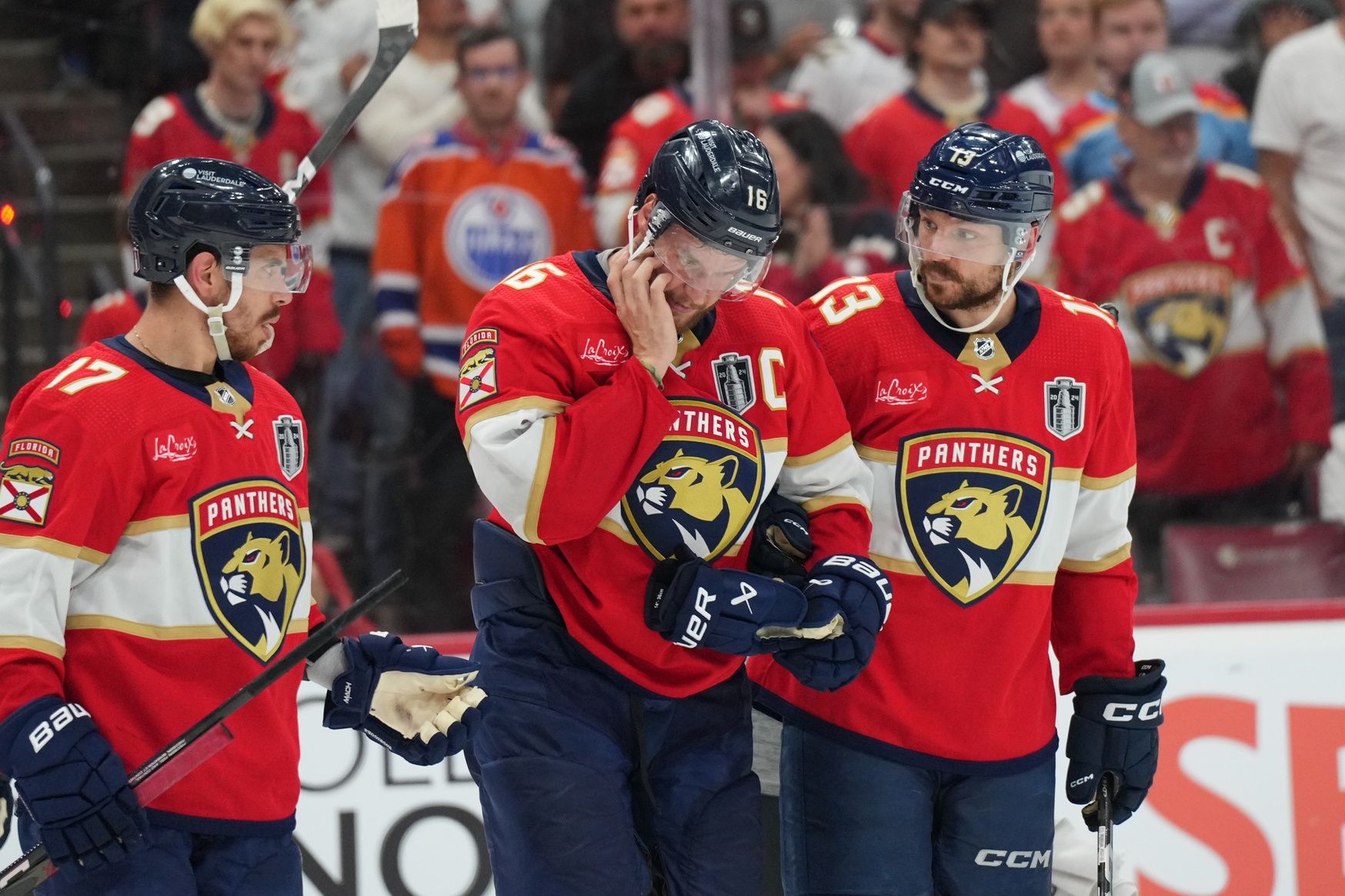 Florida Panthers forward Aleksander Barkov (16) leaves the ice holding his jaw during the third period against the Edmonton Oilers in game two of the 2024 Stanley Cup Final at Amerant Bank Arena.