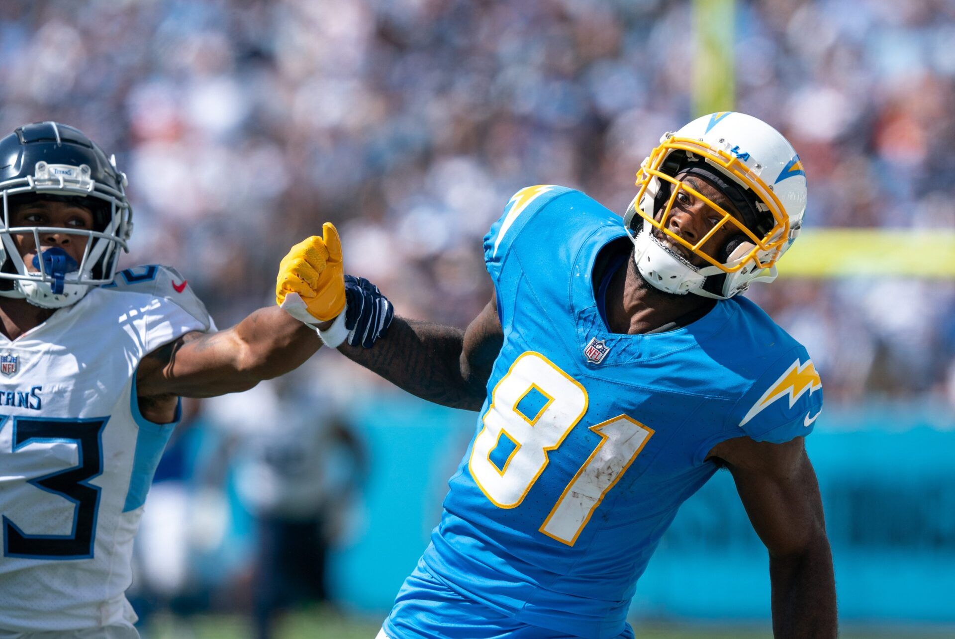 Los Angeles Chargers wide receiver Mike Williams (81) can't catch up to an overthrown pass while defended by Tennessee Titans cornerback Tre Avery (23) during their NFL game at Nissan Stadium Sunday afternoon, Sept. 17, 2023.