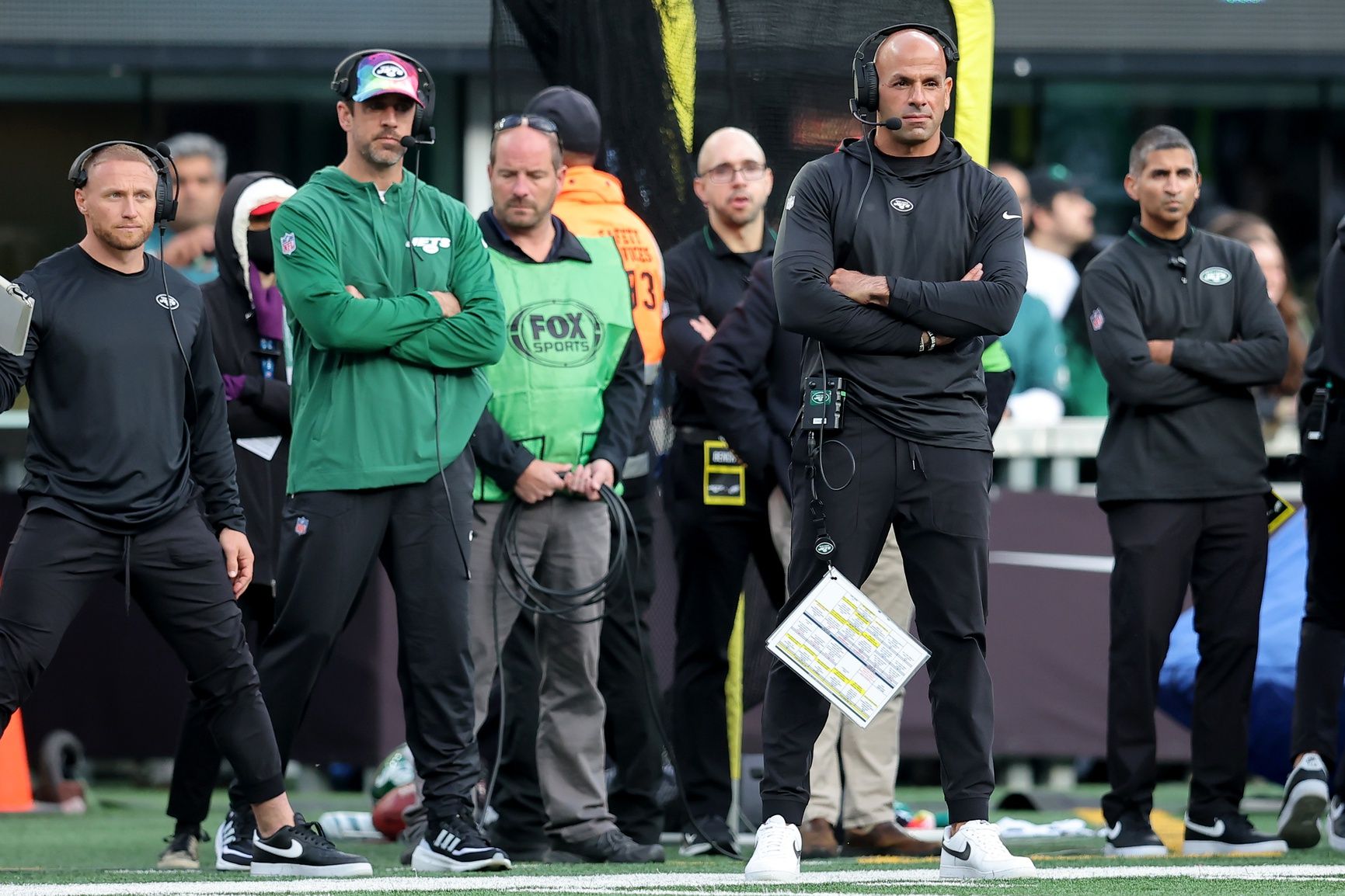 New York Jets injured quarterback Aaron Rodgers (left) and head coach Robert Saleh on the sidelines during the first quarter against the Philadelphia Eagles at MetLife Stadium.