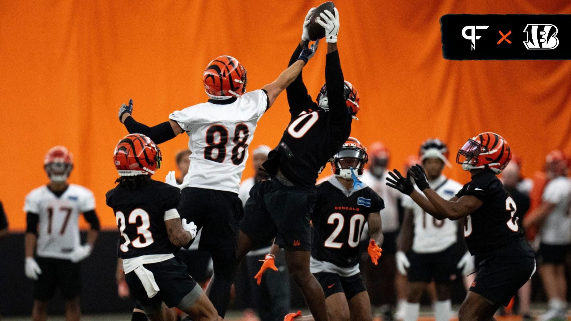 Cincinnati Bengals linebacker Shaka Heyward (50) intercepts a pass intended for Cincinnati Bengals tight end Mike Gesicki (88) at Bengals spring practice at the IEL Indoor Facility in Cincinnati on Wednesday, June 12, 2024.