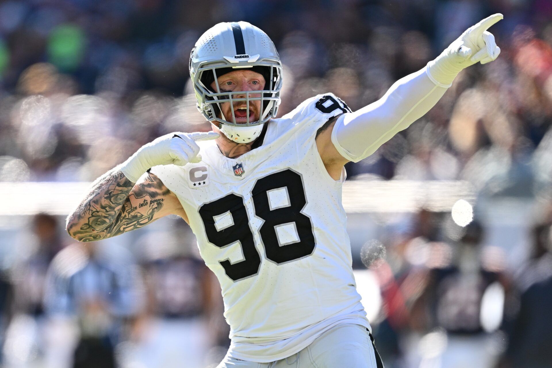 Las Vegas Raiders defensive end Maxx Crosby (98) reacts after the Chicago Bears jumped the snap in the third quarter at Soldier Field. Mandatory Credit: Jamie Sabau-USA TODAY Sports