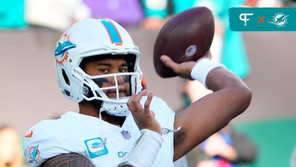 Miami Dolphins quarterback Tua Tagovailoa (1) warms up before the game against the New York Jets at MetLife Stadium. Mandatory Credit: Robert Deutsch-USA TODAY Sports