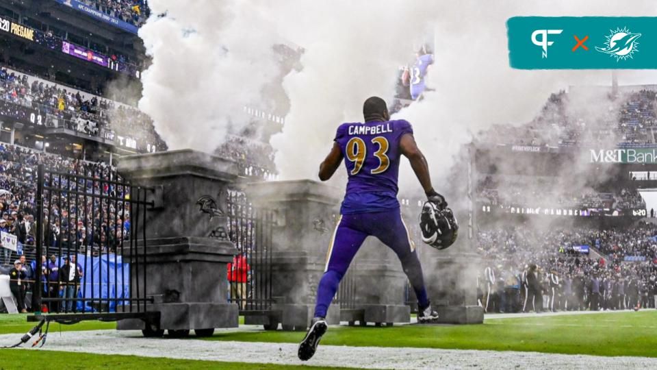 Current Miami Dolphins and former Baltimore Ravens defensive tackle Calais Campbell (93) enter the field before the game against the Buffalo Bills at M&T Bank Stadium.