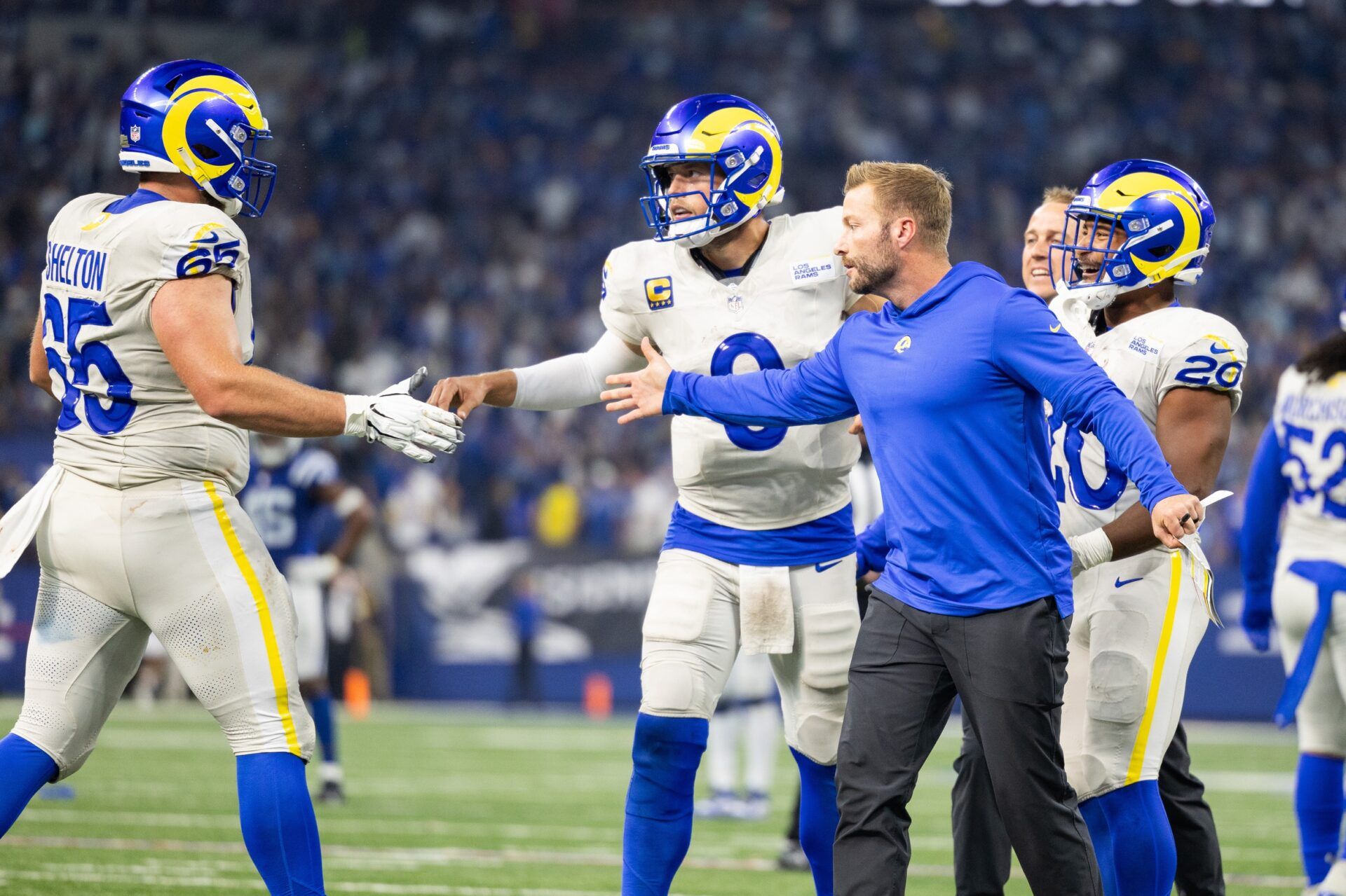 Los Angeles Rams quarterback Matthew Stafford (9) celebrates his game winning pass with teammates and head coach Sean McVay in the overtime against the Indianapolis Colts at Lucas Oil Stadium. Mandatory Credit: Trevor Ruszkowski-USA TODAY Sports