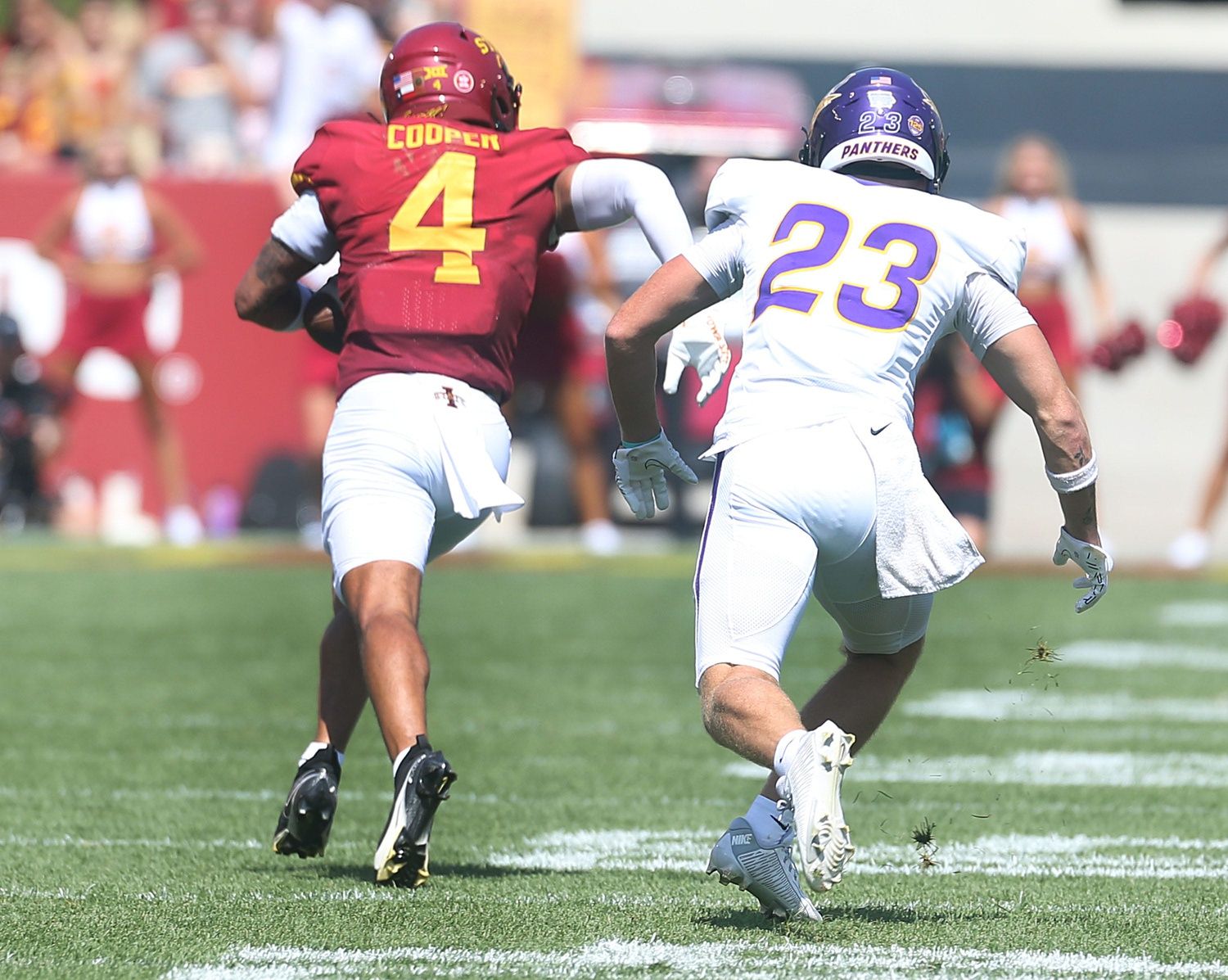 Iowa State Cyclones' defensive back Jeremiah Cooper (4) runs with the ball for a touchdown after an interception during the first quarter in the season-opening game at Jack Trice Stadium on Saturday, Sept. 2, 2023, in Ames, Iowa.