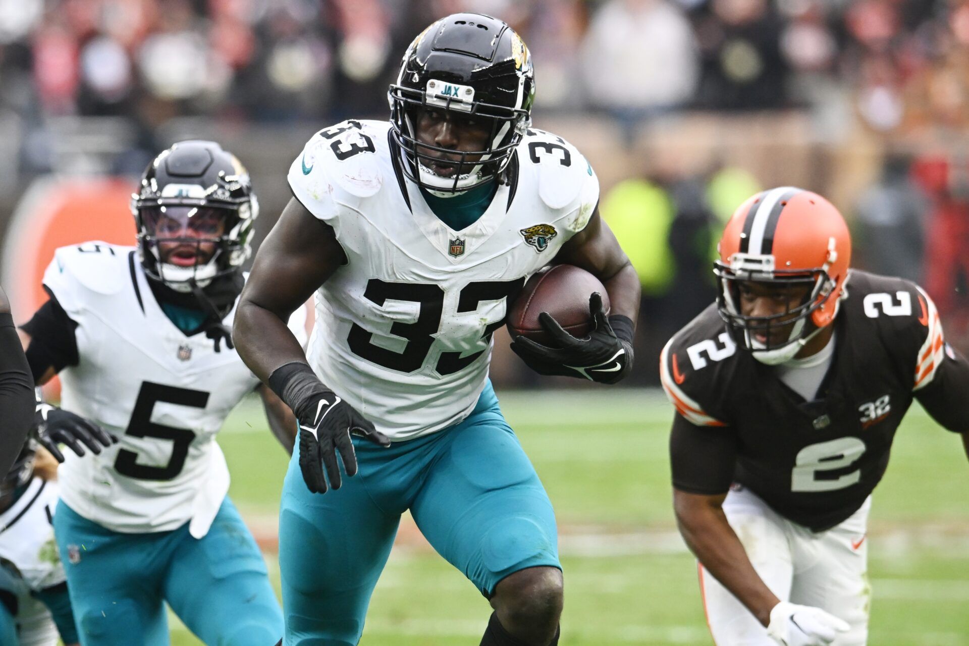 Jacksonville Jaguars linebacker Devin Lloyd (33) returns a fumble during the first half against the Cleveland Browns at Cleveland Browns Stadium. Mandatory Credit: Ken Blaze-USA TODAY Sports