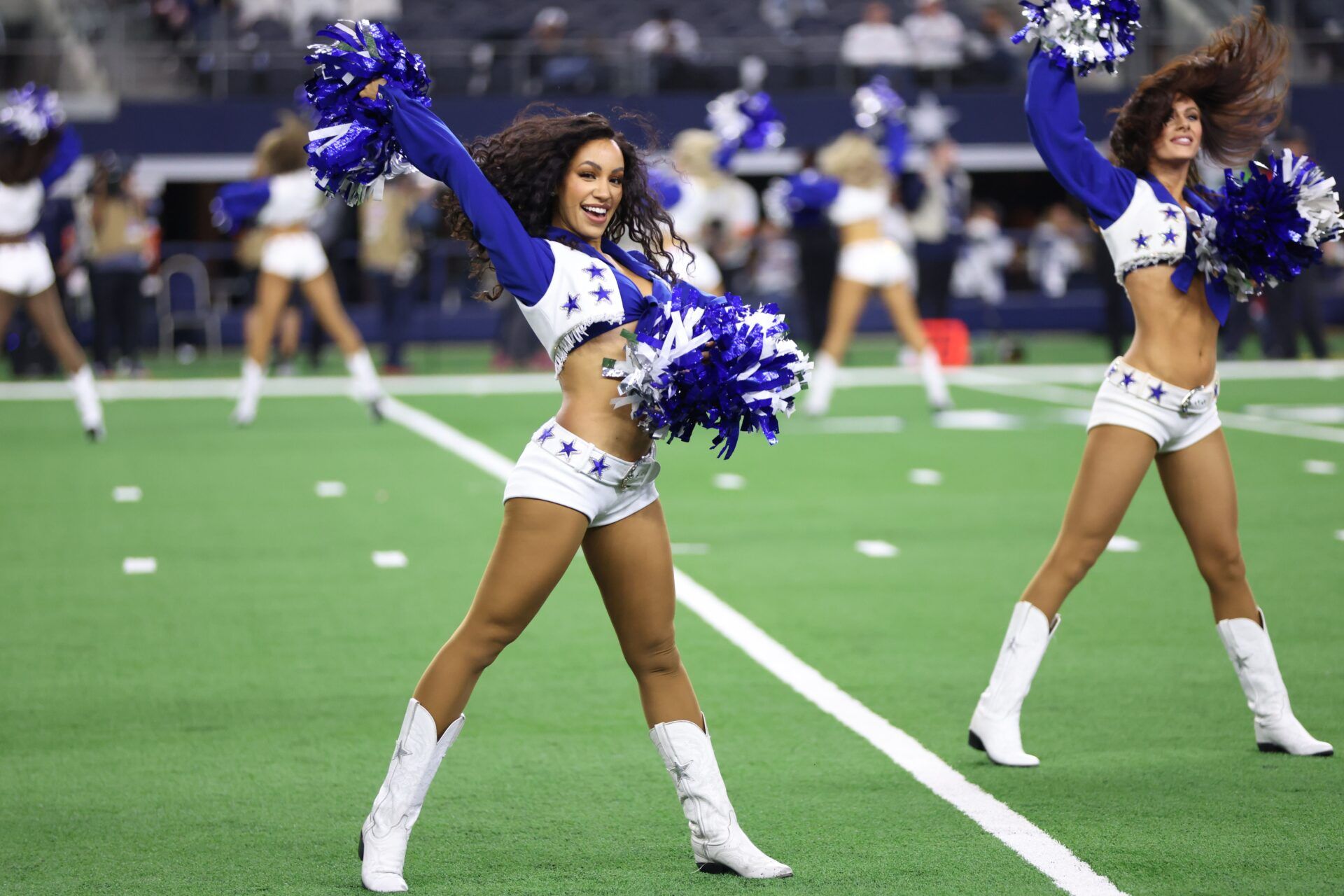 The Dallas Cowboys cheerleaders perform during halftime of the Wild Card game against the Green Bay Packers.