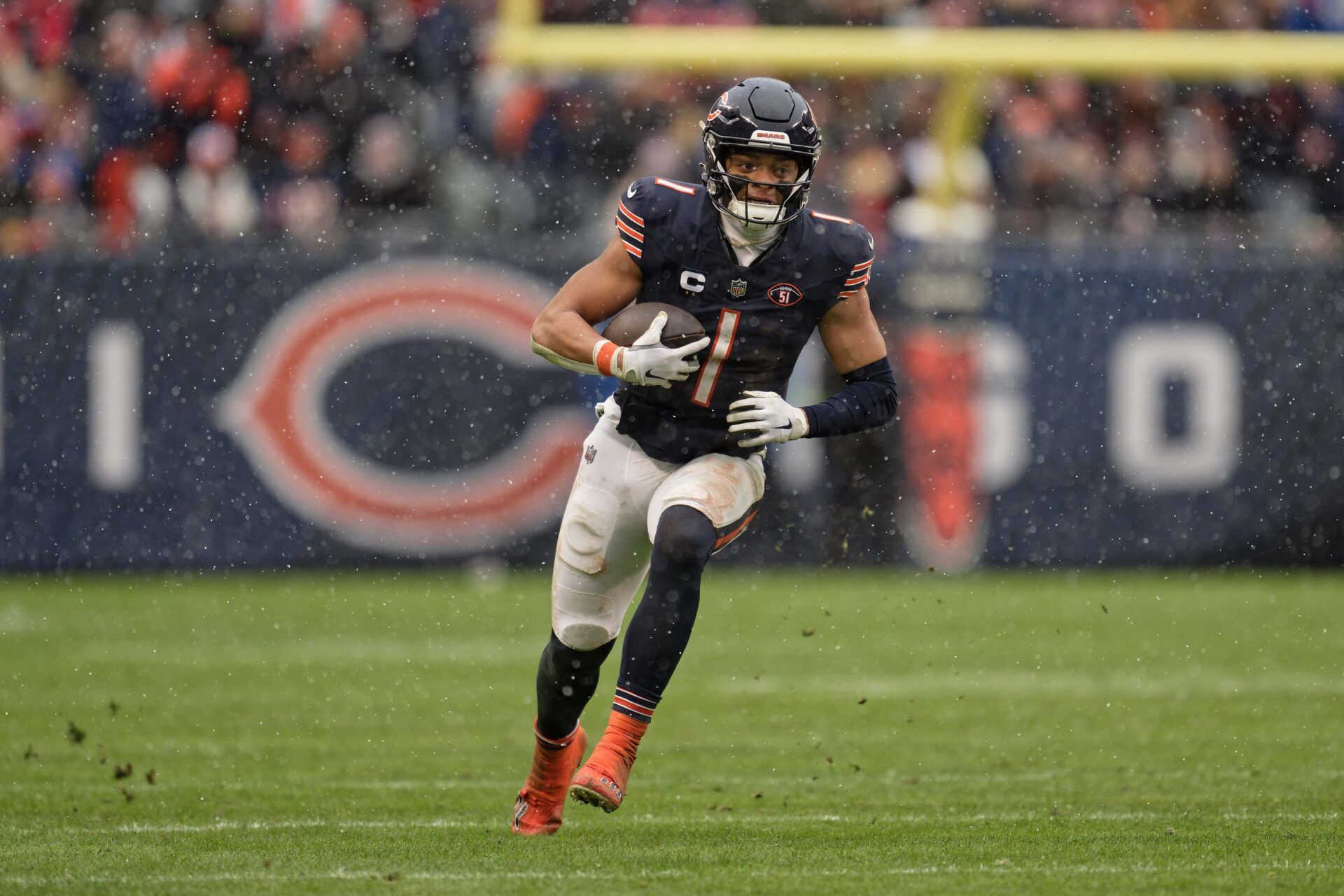 Chicago Bears quarterback Justin Fields (1) runs with the ball against the Atlanta Falcons at Soldier Field. Fields was a ley part of the latest Madden NFL 25 trailer. Mandatory Credit: Jamie Sabau-USA TODAY Sports