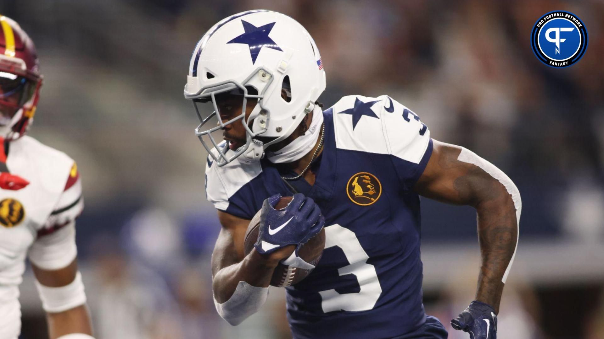 Dallas Cowboys wide receiver Brandin Cooks (3) scores a touchdown against Washington Commanders safety Percy Butler (35) in the second quarter at AT&T Stadium.