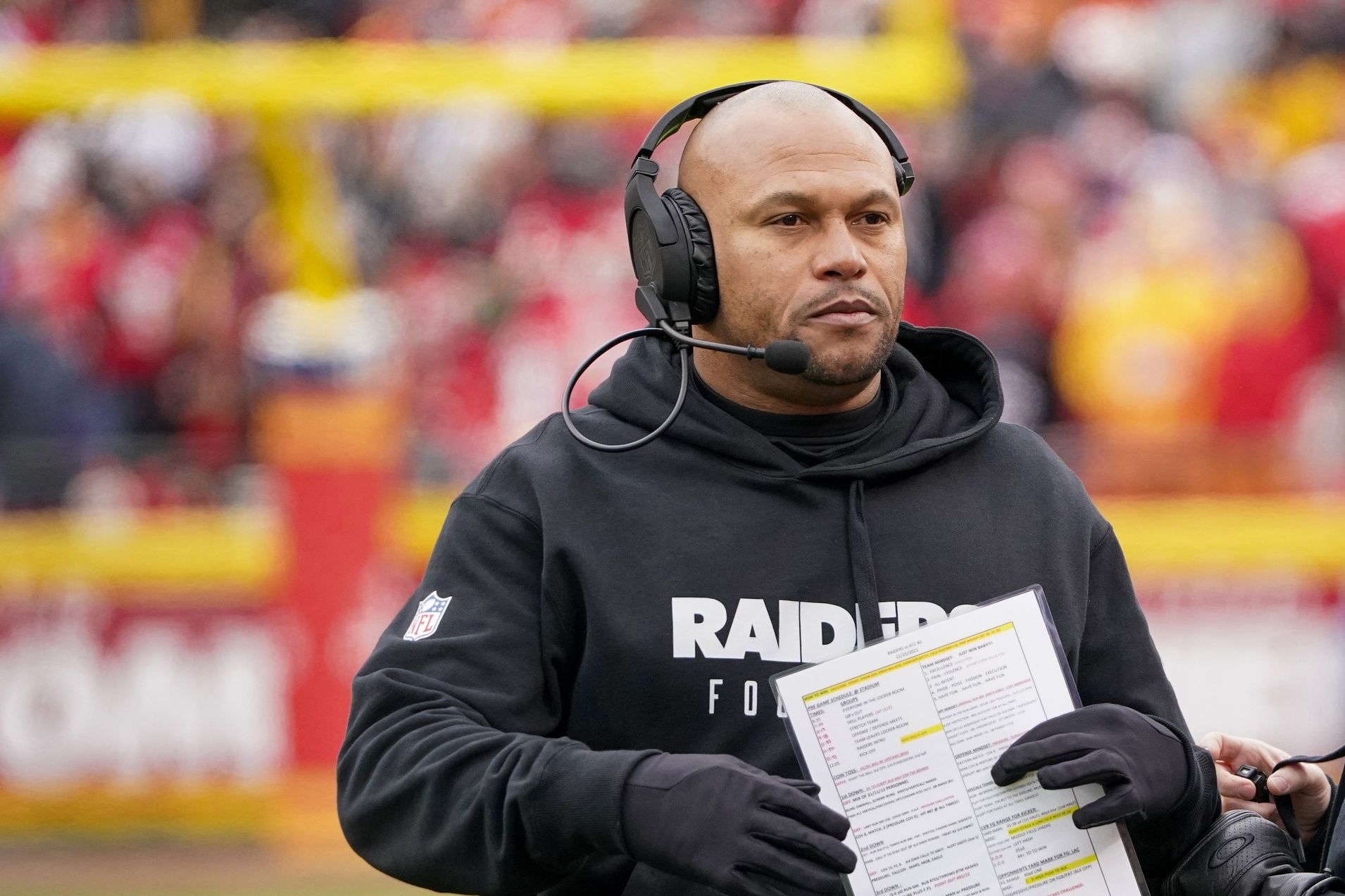 Las Vegas Raiders interim head coach Antonio Pierce on field against the Kansas City Chiefs during the first half at GEHA Field at Arrowhead Stadium.