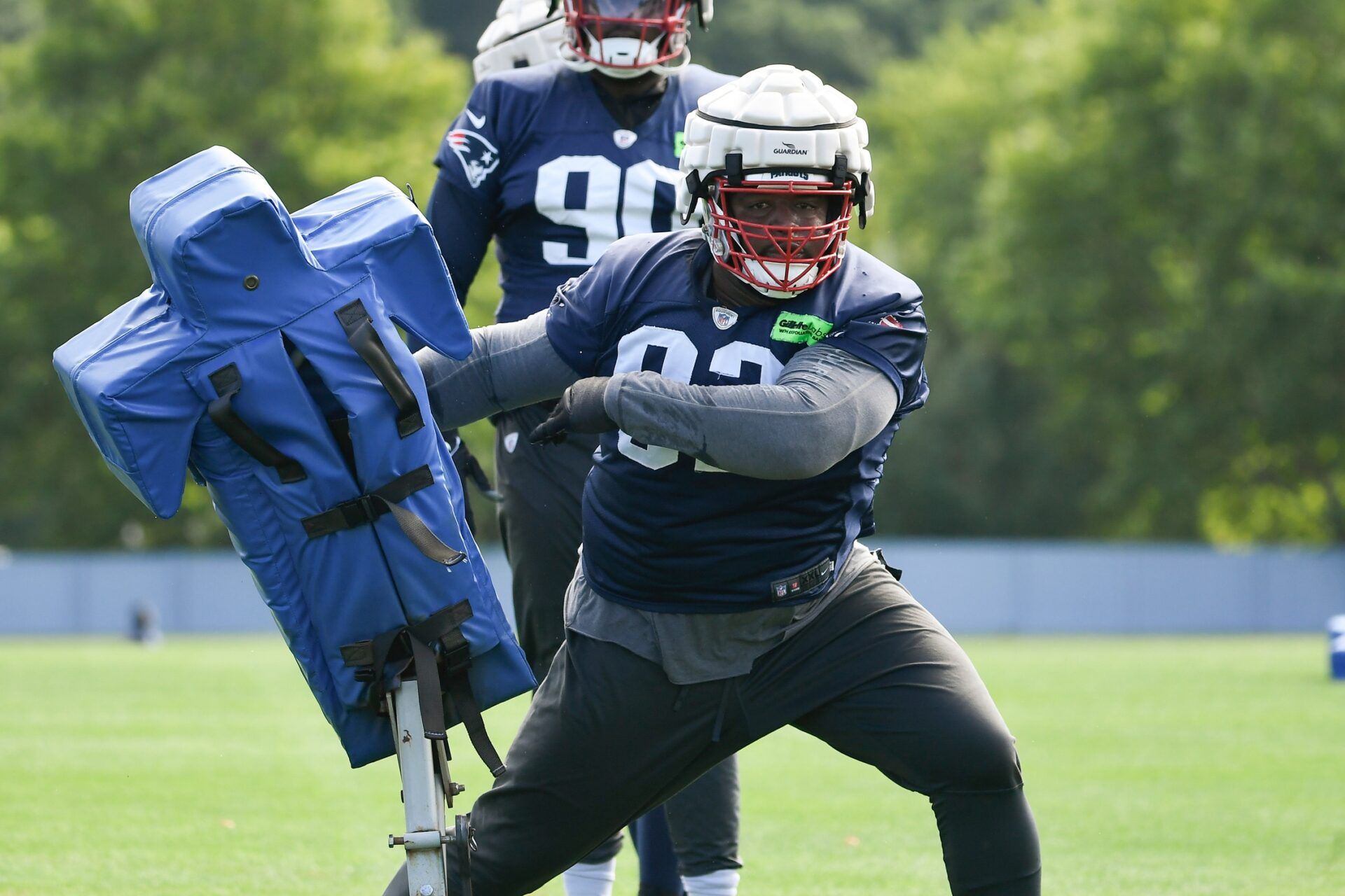 New England Patriots nose tackle Davon Godchaux (92) works with a training aid at the Patriots training camp at Gillette Stadium.