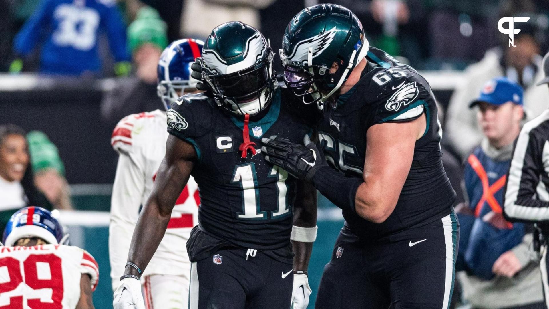 Philadelphia Eagles wide receiver A.J. Brown (11) and offensive tackle Lane Johnson (65) celebrate after a play against the New York Giants during the fourth quarter at Lincoln Financial Field.