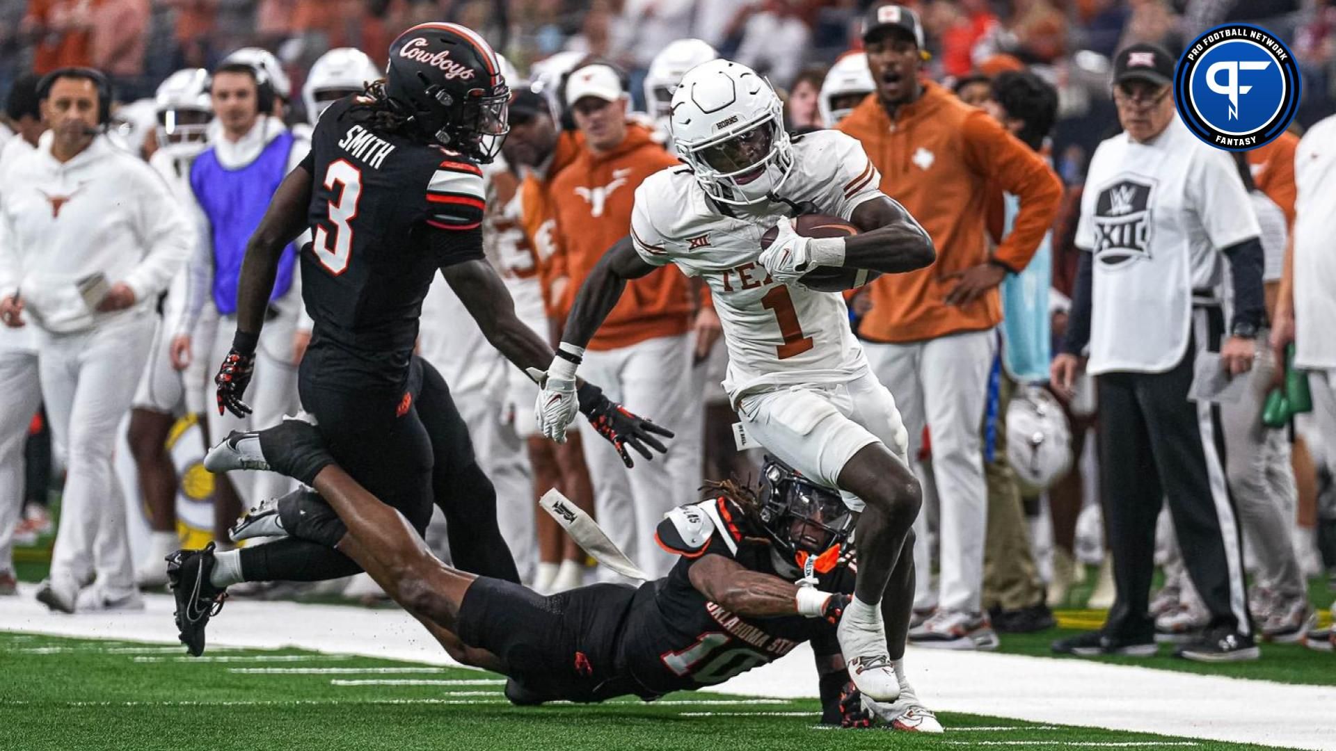 Texas Longhorns wide receiver Xavier Worthy (1) runs the ball down the sideline during the Big 12 Championship game against the Oklahoma State Cowboys at AT&T stadium on Saturday, Dec. 2, 2023 in Arlington.