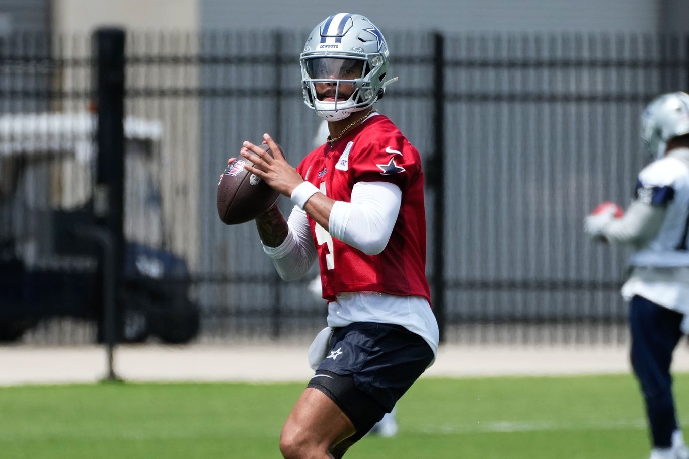 Dallas Cowboys quarterback Dak Prescott (4) goes through a drill during practice at the Ford Center at the Star Training Facility in Frisco, Texas.