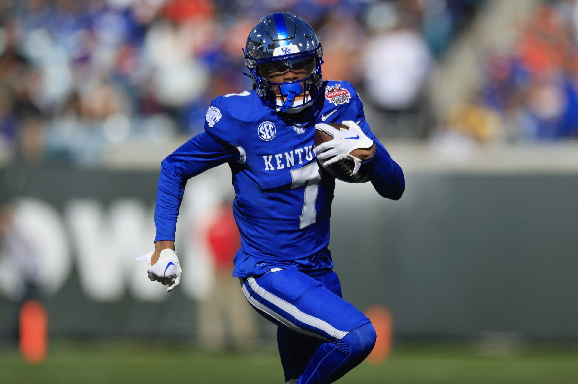 Kentucky Wildcats wide receiver Barion Brown (7) scores a touchdown during the first quarter of an NCAA football matchup in the TaxSlayer Gator Bowl Friday, Dec. 29, 2023 at EverBank Stadium in Jacksonville, Fla. [Corey Perrine/Florida Times-Union]