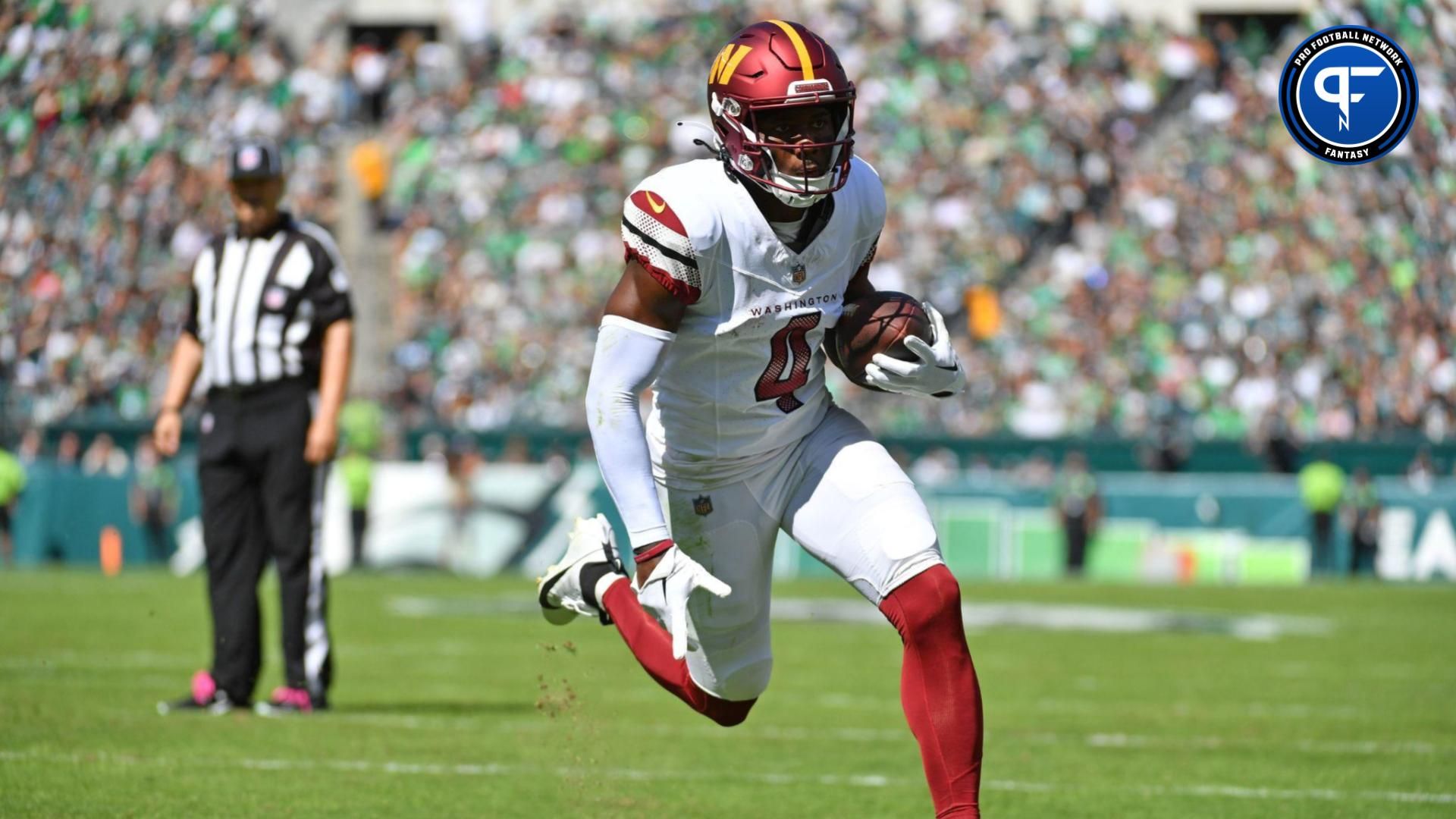 Washington Commanders wide receiver Curtis Samuel (4) scores on a one- yard touchdown run against the Philadelphia Eagles during the first quarter at Lincoln Financial Field. Mandatory Credit: Eric Hartline-USA TODAY Sports