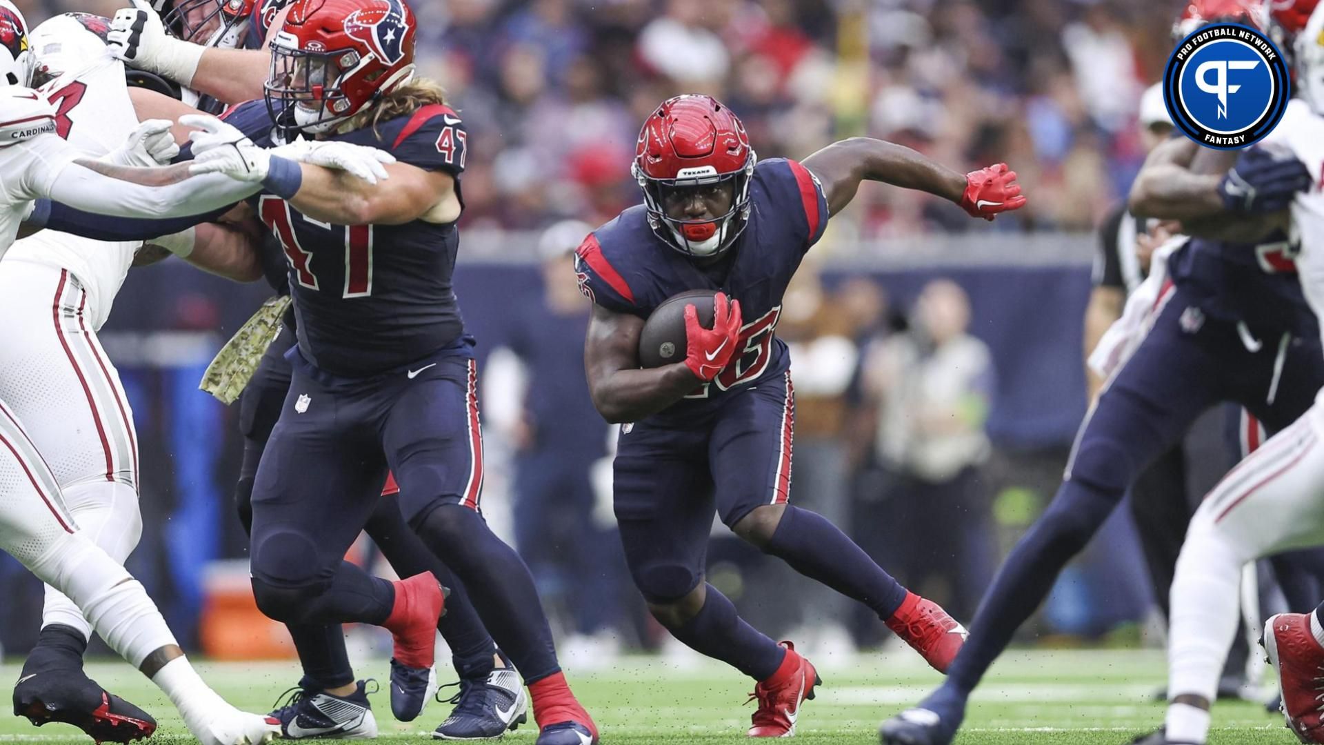 Houston Texans running back Devin Singletary (26) runs with the ball during the second quarter against the Arizona Cardinals at NRG Stadium.