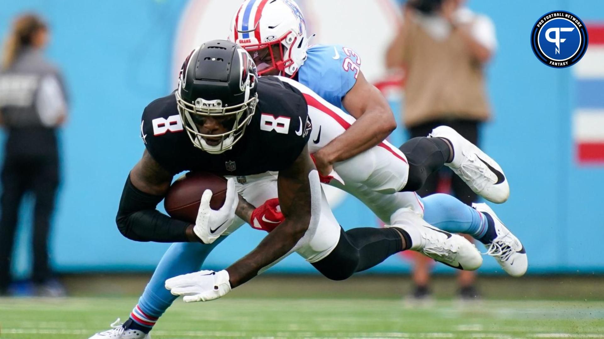 Atlanta Falcons tight end Kyle Pitts (8) is pulled down by Tennessee Titans cornerback Eric Garror (33) during the second quarter at Nissan Stadium in Nashville, Tenn., Sunday, Oct. 29, 2023.