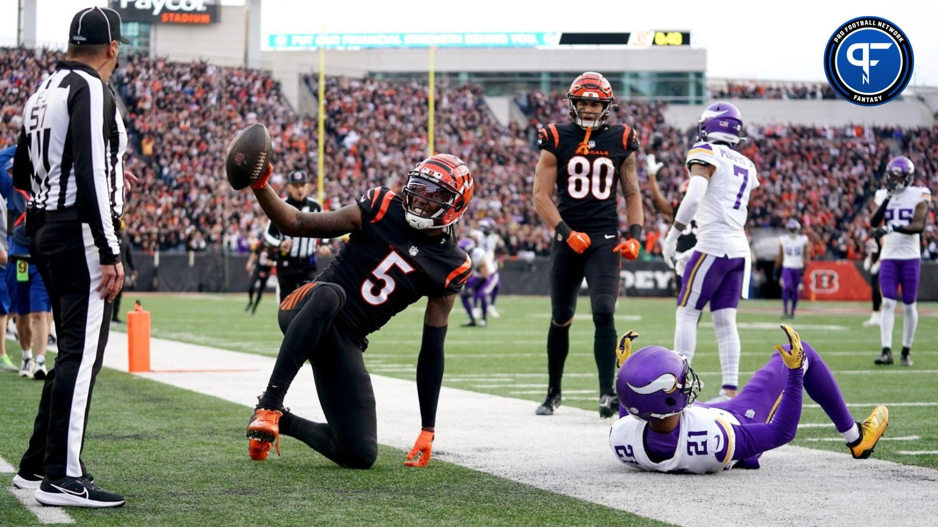 Cincinnati Bengals wide receiver Tee Higgins (5) gestures toward the official after catching a touchdown pass as Minnesota Vikings cornerback Akayleb Evans (21) defends in the fourth quarter of a Week 15 NFL football game between the Minnesota Vikings and the Cincinnati Bengals, Saturday, Dec. 16, 2023, at Paycor Stadium in Cincinnati. The Cincinnati Bengals won 27-24 in overtime.