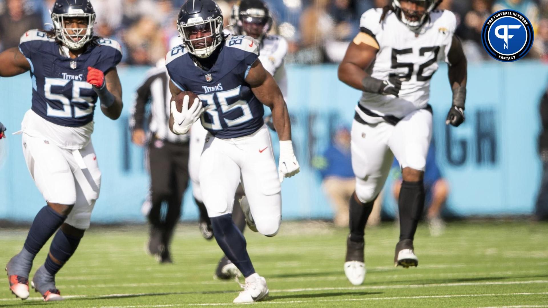 Tennessee Titans TE Chigoziem Okonkwo (85) runs after the catch against the Jacksonville Jaguars.