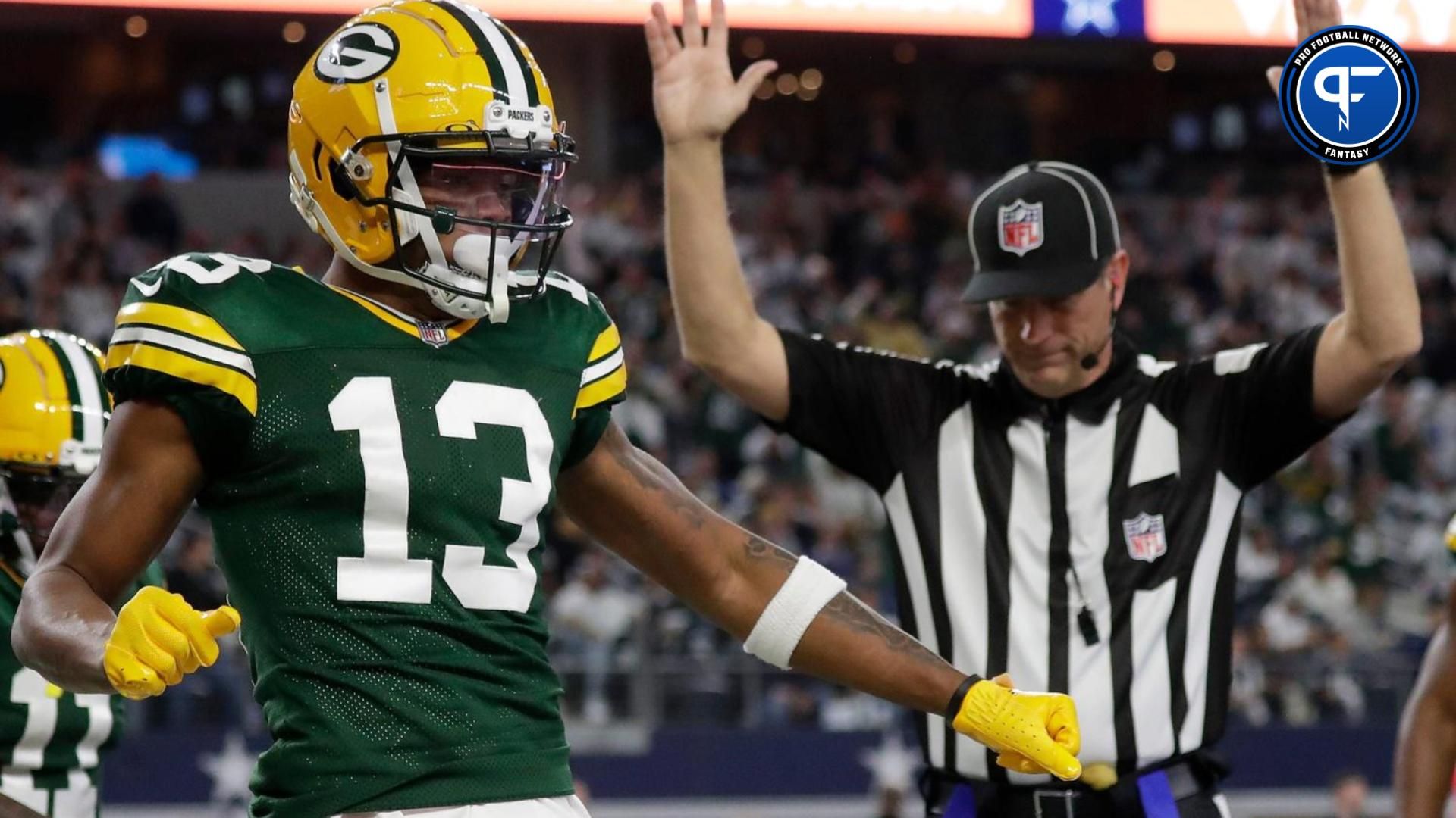 Green Bay Packers WR Dontayvion Wicks (13) celebrates after scoring a touchdown against the Dallas Cowboys.