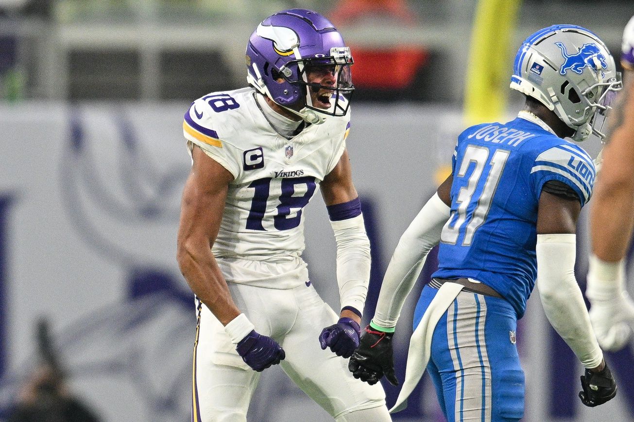 Minnesota Vikings wide receiver Justin Jefferson (18) reacts with Detroit Lions safety Kerby Joseph (31) during the game at U.S. Bank Stadium.