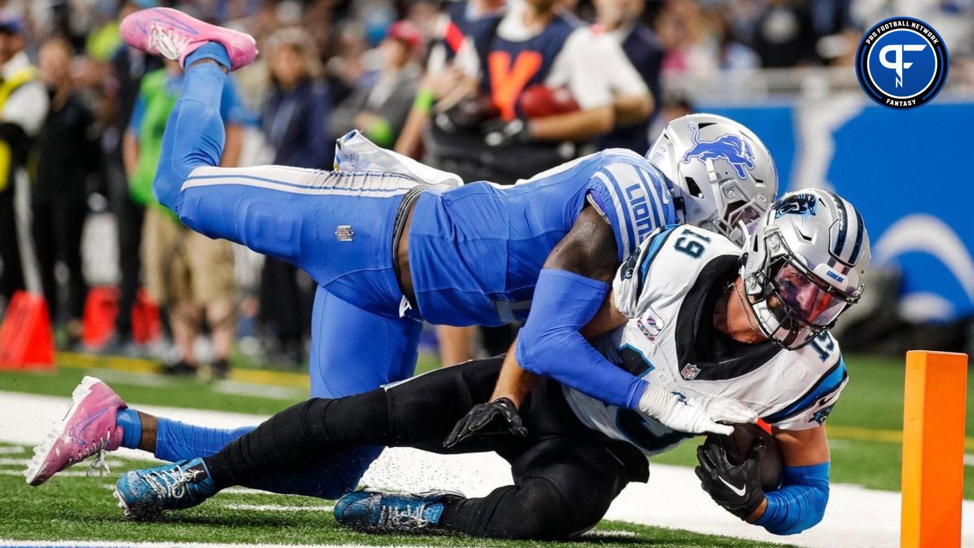 Panthers wide receiver Adam Thielen scores a touchdown against Lions safety Tracy Walker III during the second half of the Lions' 42-24 win on Sunday, Oct. 8, 2023, at Ford Field.