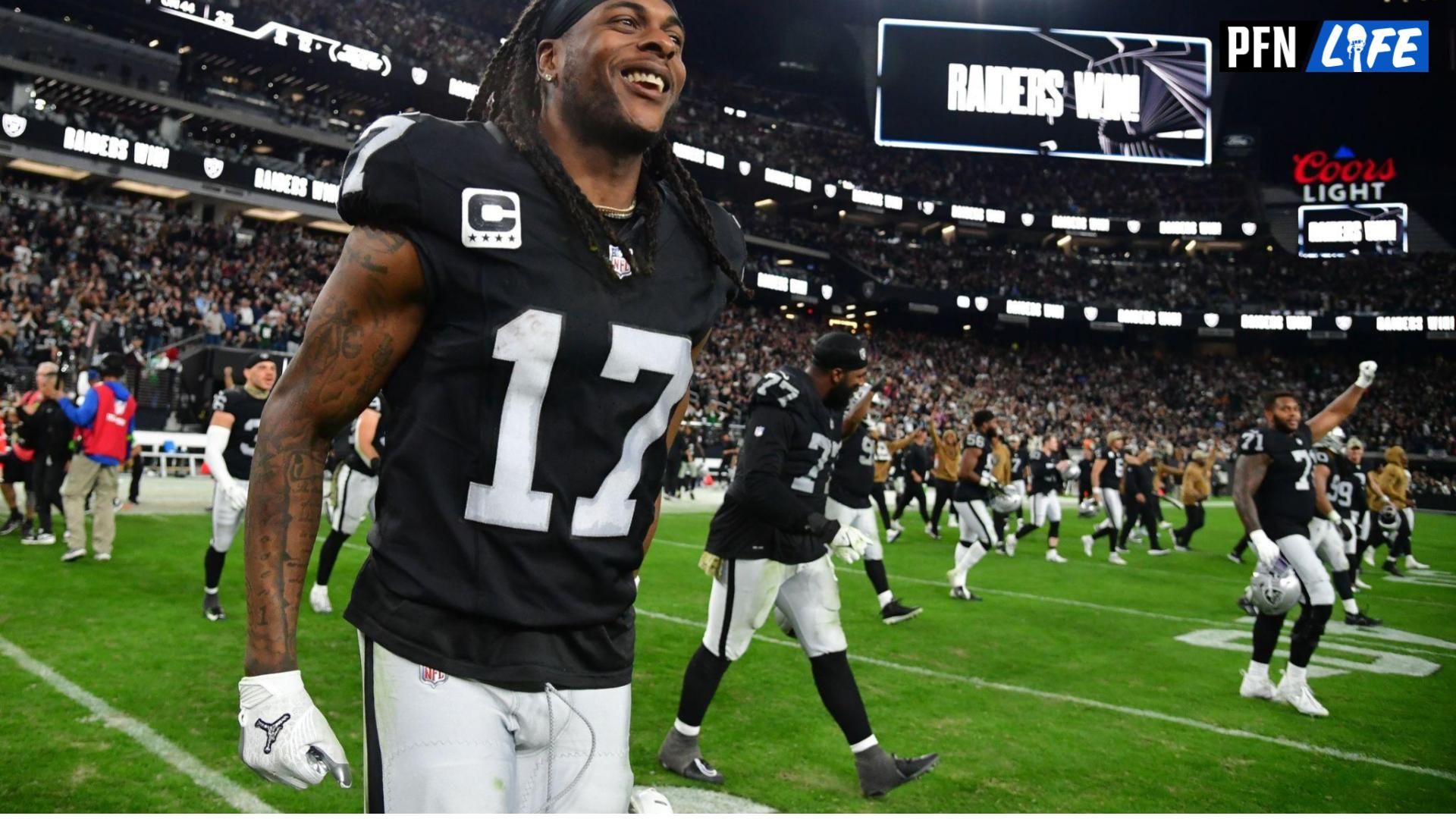 Las Vegas Raiders WR Davante Adams (17) celebrates on the field after a victory over the New York Jets.