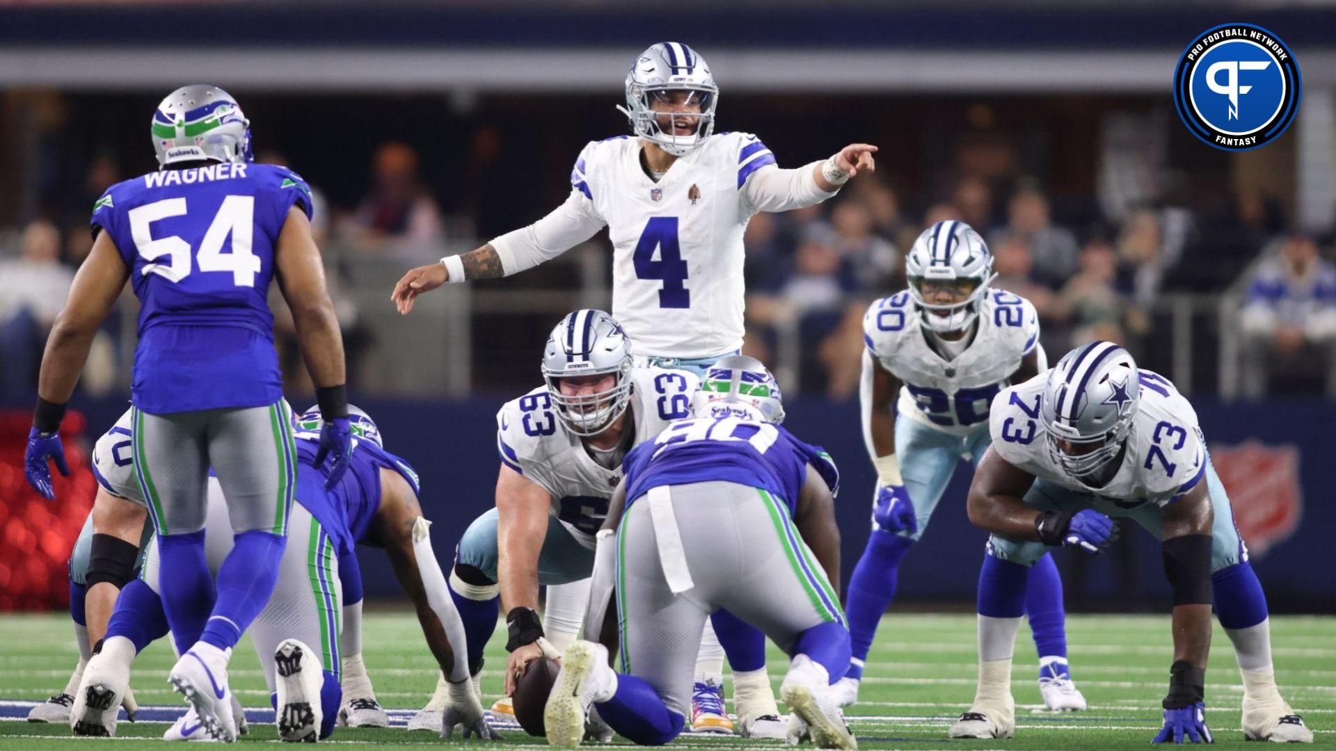 Dallas Cowboys quarterback Dak Prescott (4) gestures at the line of scrimmage during the first half against the Seattle Seahawks at AT&T Stadium.