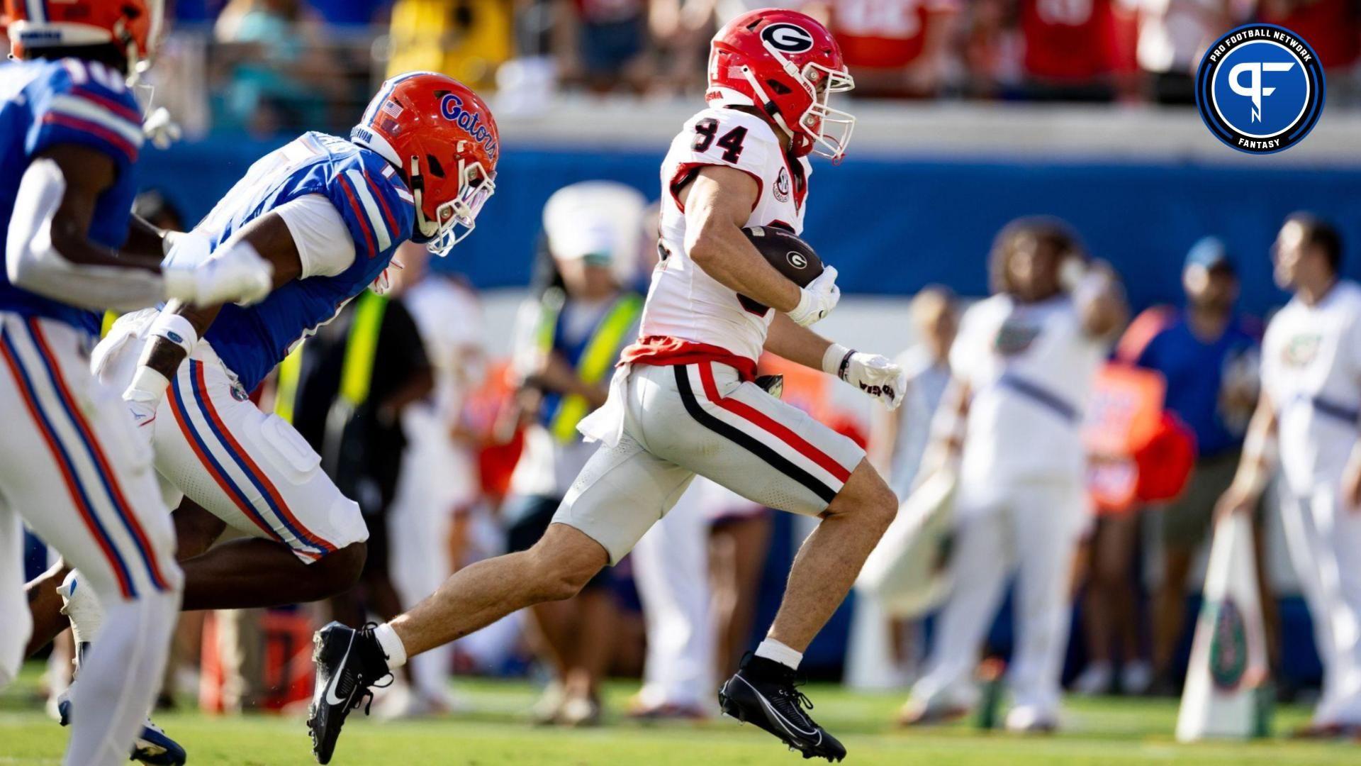 Georgia Bulldogs wide receiver Ladd McConkey (84) rushes for a touchdown during the first half against the Florida Gators at Everbank Stadium in Jacksonville, FL on Saturday, October 28, 2023.