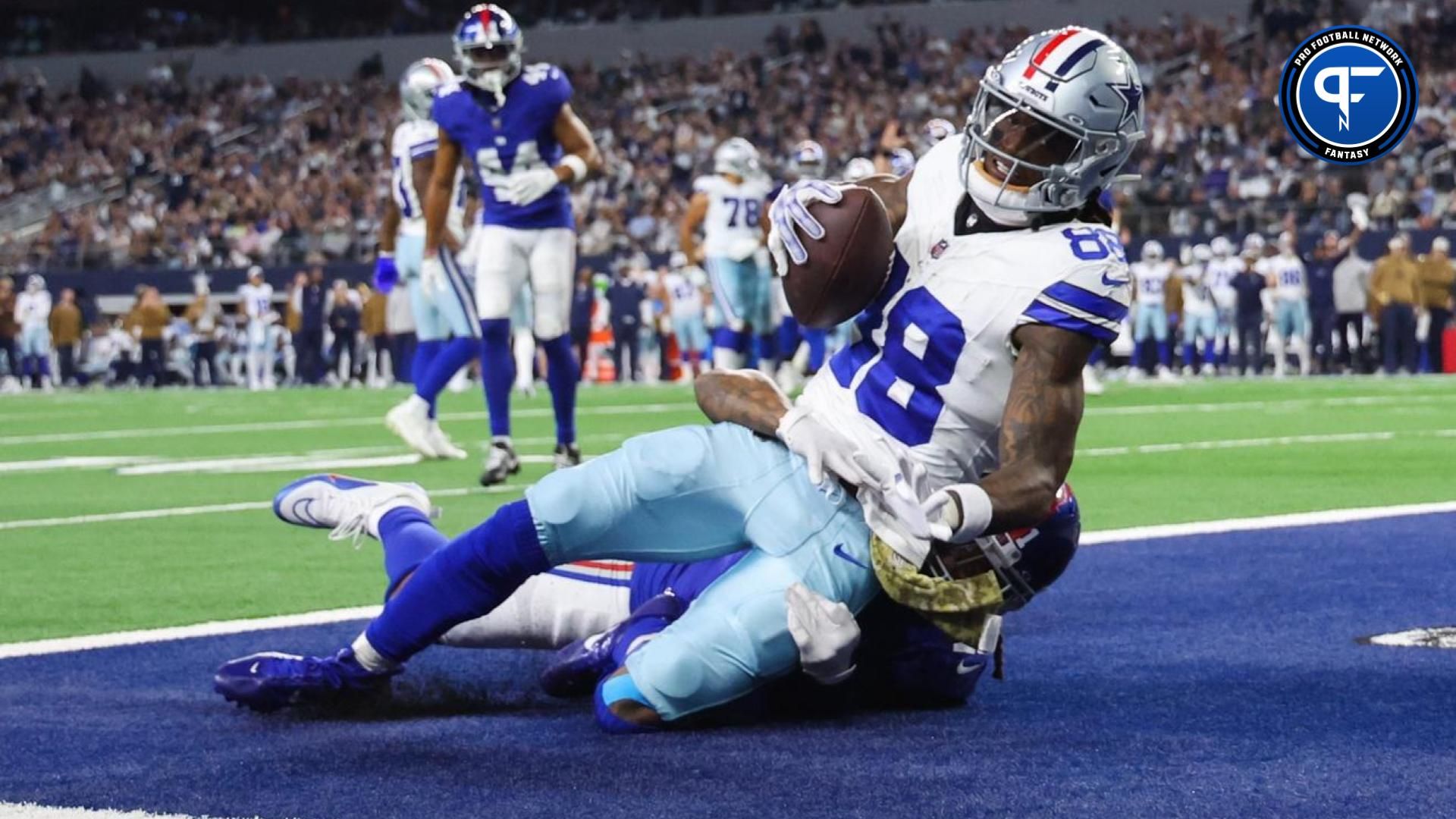 Dallas Cowboys wide receiver CeeDee Lamb (88) makes a touchdown catch past New York Giants safety Bobby McCain (21) during the second half at AT&T Stadium.