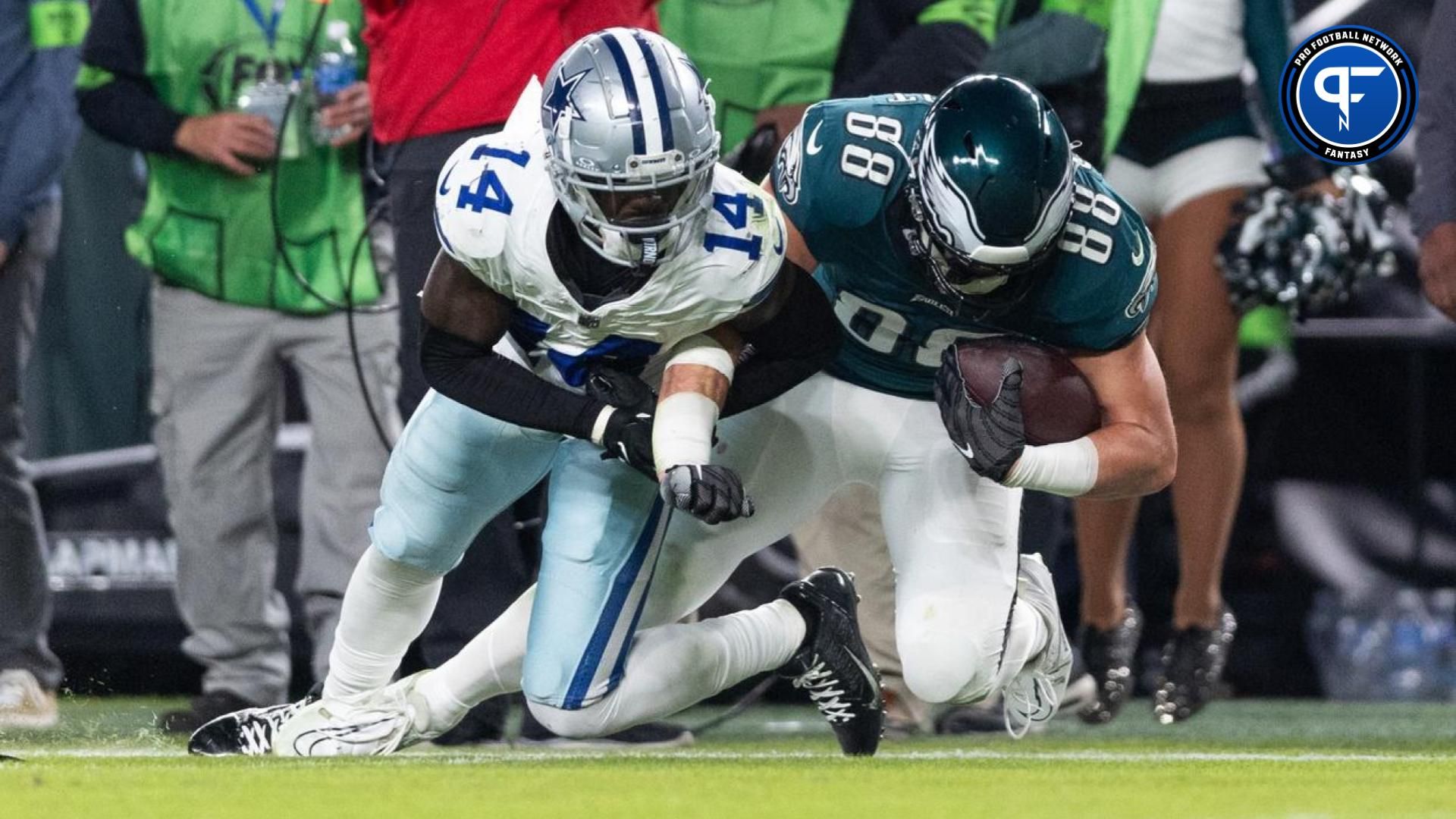 Dallas Cowboys safety Markquese Bell (14) tackles Philadelphia Eagles tight end Dallas Goedert (88) at Lincoln Financial Field.