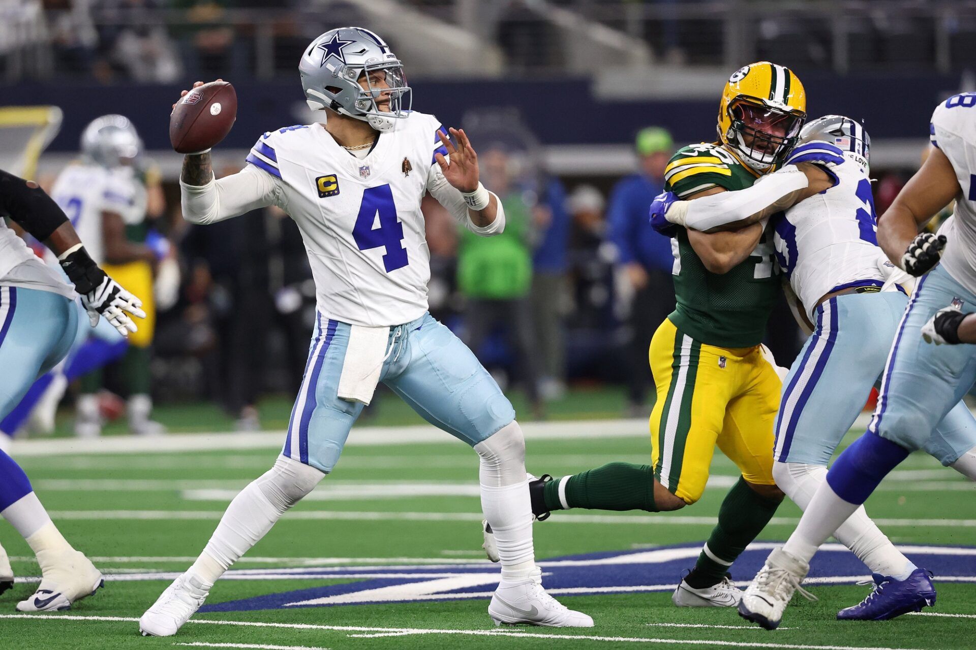 Dallas Cowboys quarterback Dak Prescott (4) drops back to pass against the Green Bay Packers during the second half for the 2024 NFC wild card game at AT&T Stadium. Mandatory Credit: Kevin Jairaj-USA TODAY Sports