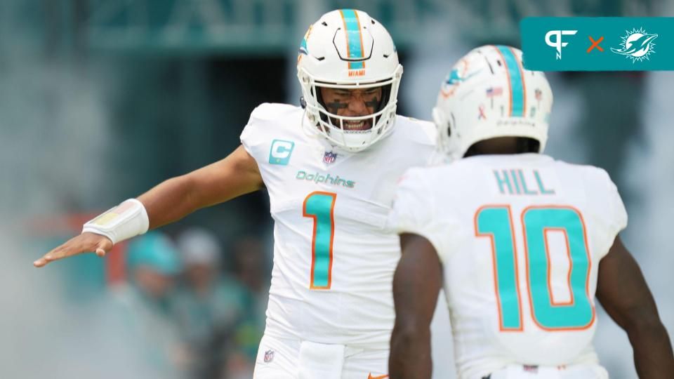 Miami Dolphins quarterback Tua Tagovailoa (1) and wide receiver Tyreek Hill (10) take the field before the opening game of the season against the New England Patriots at Hard Rock Stadium in Miami Gardens, Sept. 11, 2022.