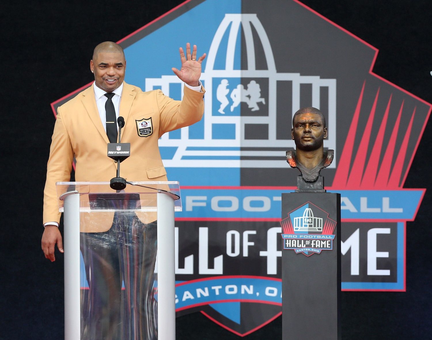 Richard Seymour speaks after unveiling his bust during the Pro Football Hall of Fame Enshrinement at Tom Benson Stadium in Canton on Saturday, August 6, 2022.