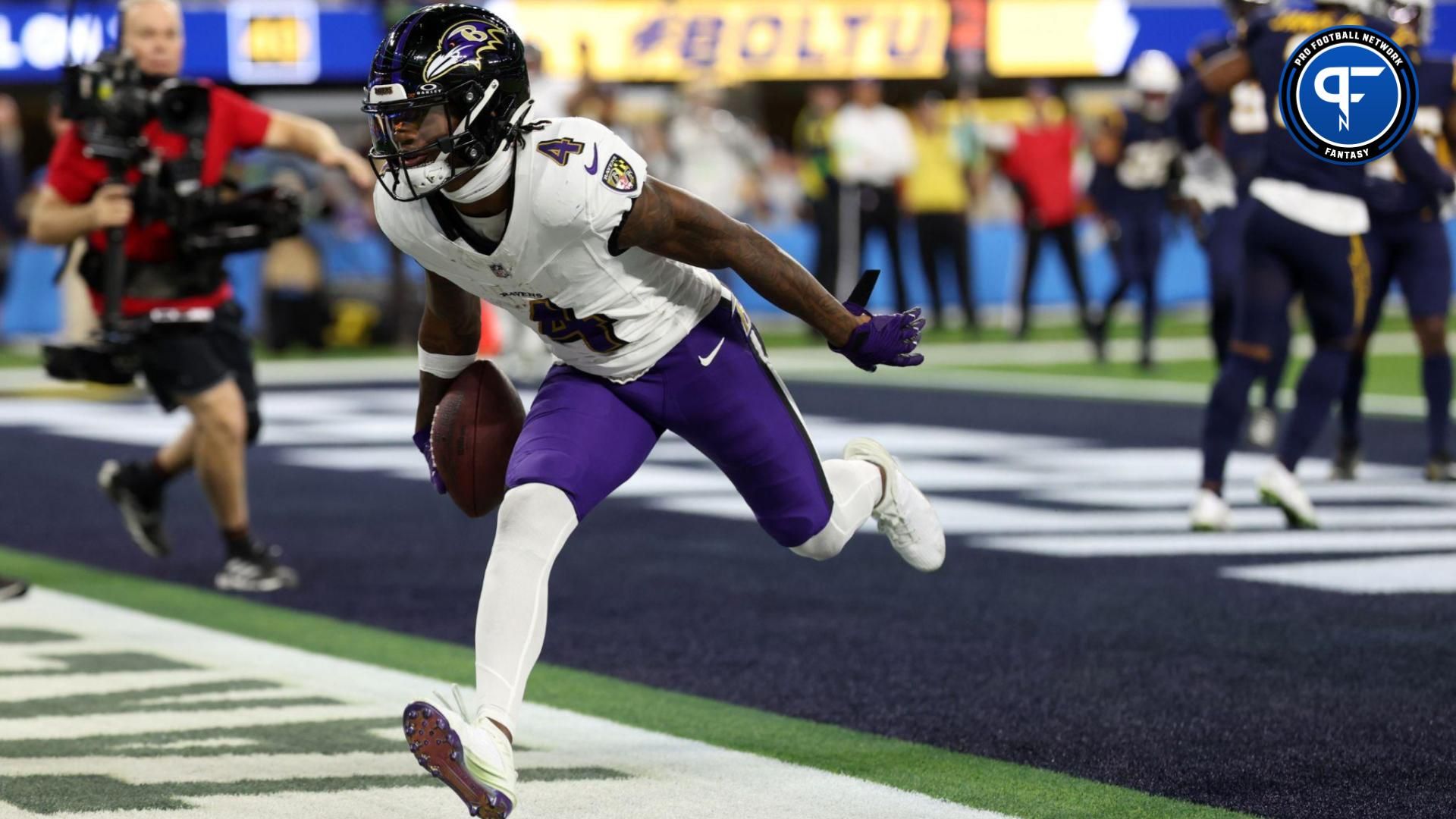 Baltimore Ravens wide receiver Zay Flowers (4) reacts after catching a touchdown pass during the second quarter against the Los Angeles Chargers at SoFi Stadium.