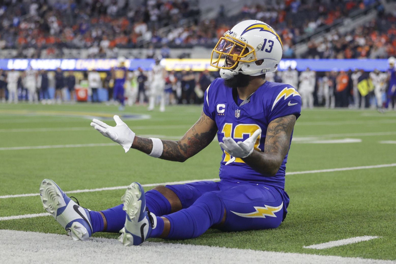Los Angeles Chargers wide receiver Keenan Allen (13) singles to the referees during the second half in a game against the Denver Broncos at SoFi Stadium.