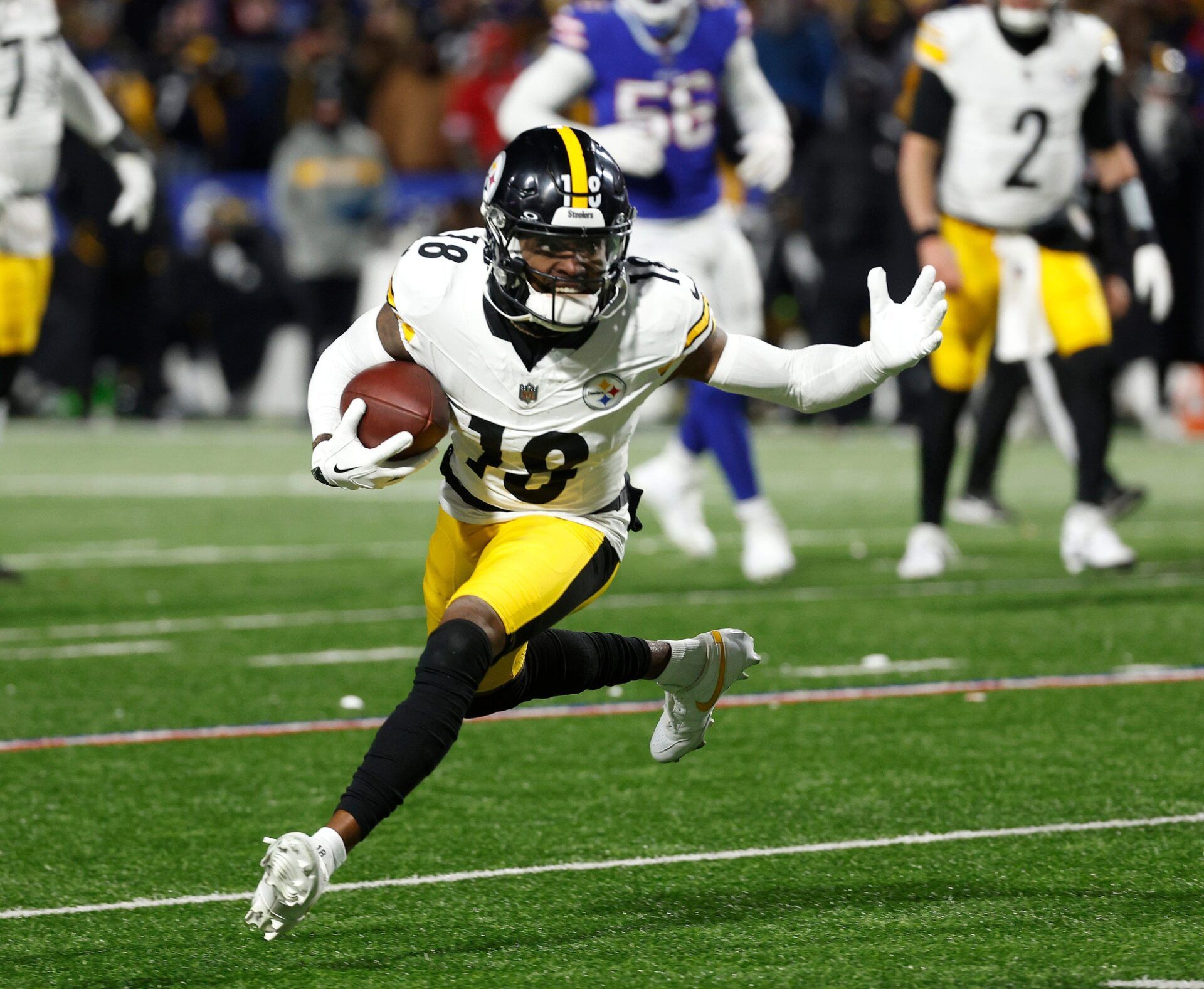 Pittsburgh Steelers wide receiver Diontae Johnson (18) tries to cut back against the Bills.