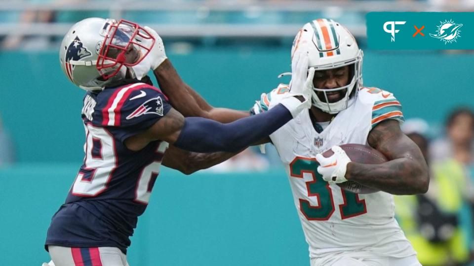 Miami Dolphins running back Raheem Mostert (31) stiff-arms New England Patriots cornerback J.C. Jackson (29) during the second half of an NFL game at Hard Rock Stadium in Miami Gardens, Oct. 29, 2023.