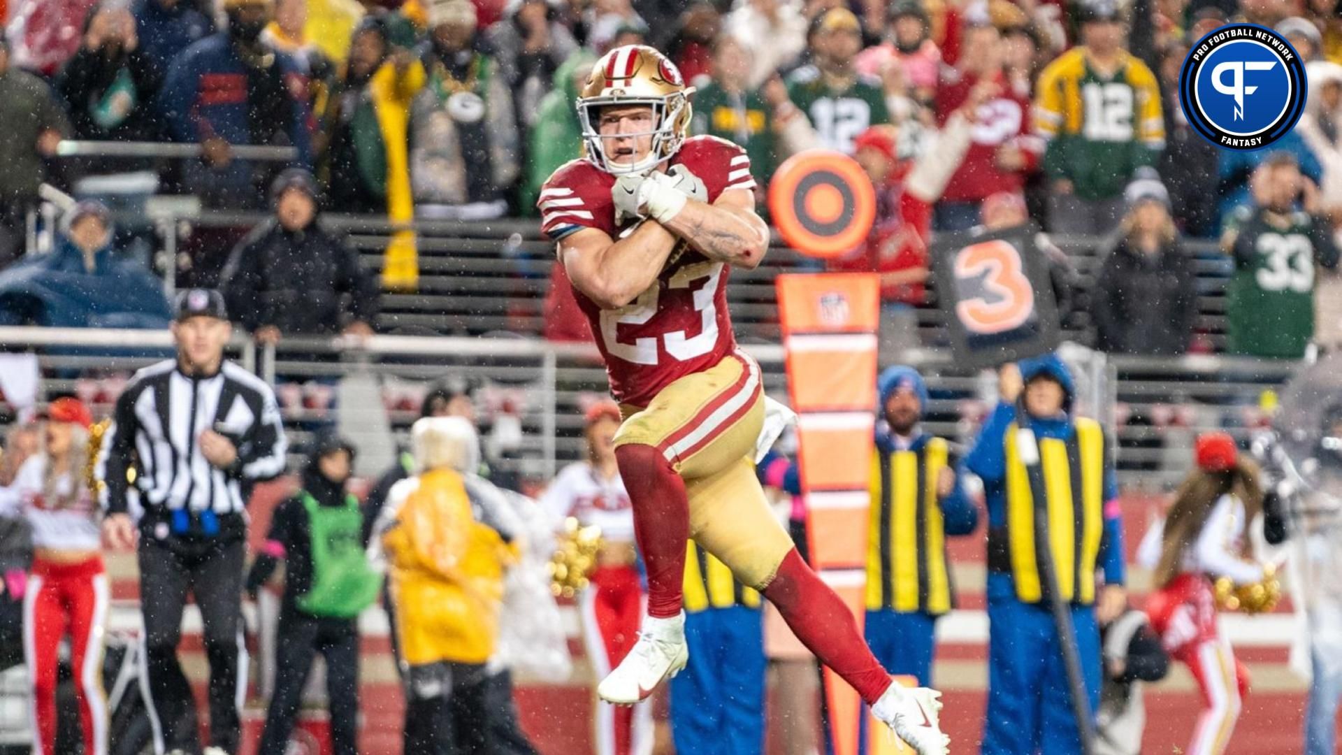 San Francisco 49ers running back Christian McCaffrey (23) scores a touchdown during the fourth quarter in a 2024 NFC divisional round game against the Green Bay Packers at Levi's Stadium. Where should he be selected in a 2024 redraft mock draft? Mandatory Credit: Kyle Terada-USA TODAY Sports