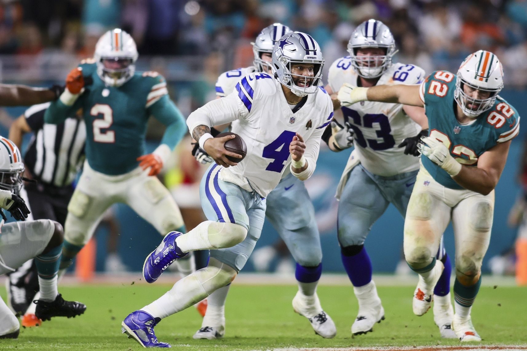 Dallas Cowboys quarterback Dak Prescott (4) runs with the football against the Miami Dolphins during the fourth quarter at Hard Rock Stadium.