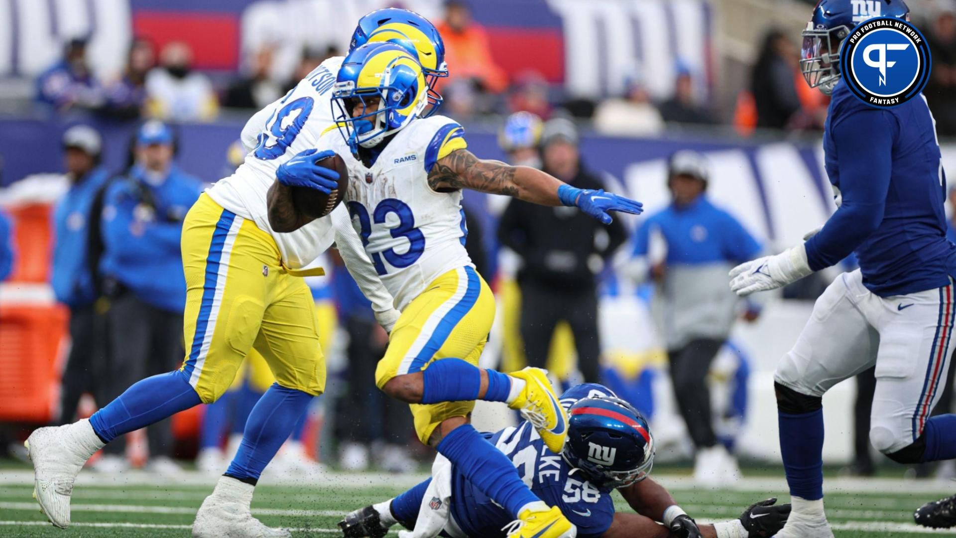 Los Angeles Rams running back Kyren Williams (23) scores a rushing touchdown as Los Angeles Rams guard Kevin Dotson (69) blocks New York Giants linebacker Bobby Okereke (58) during the second half at MetLife Stadium.