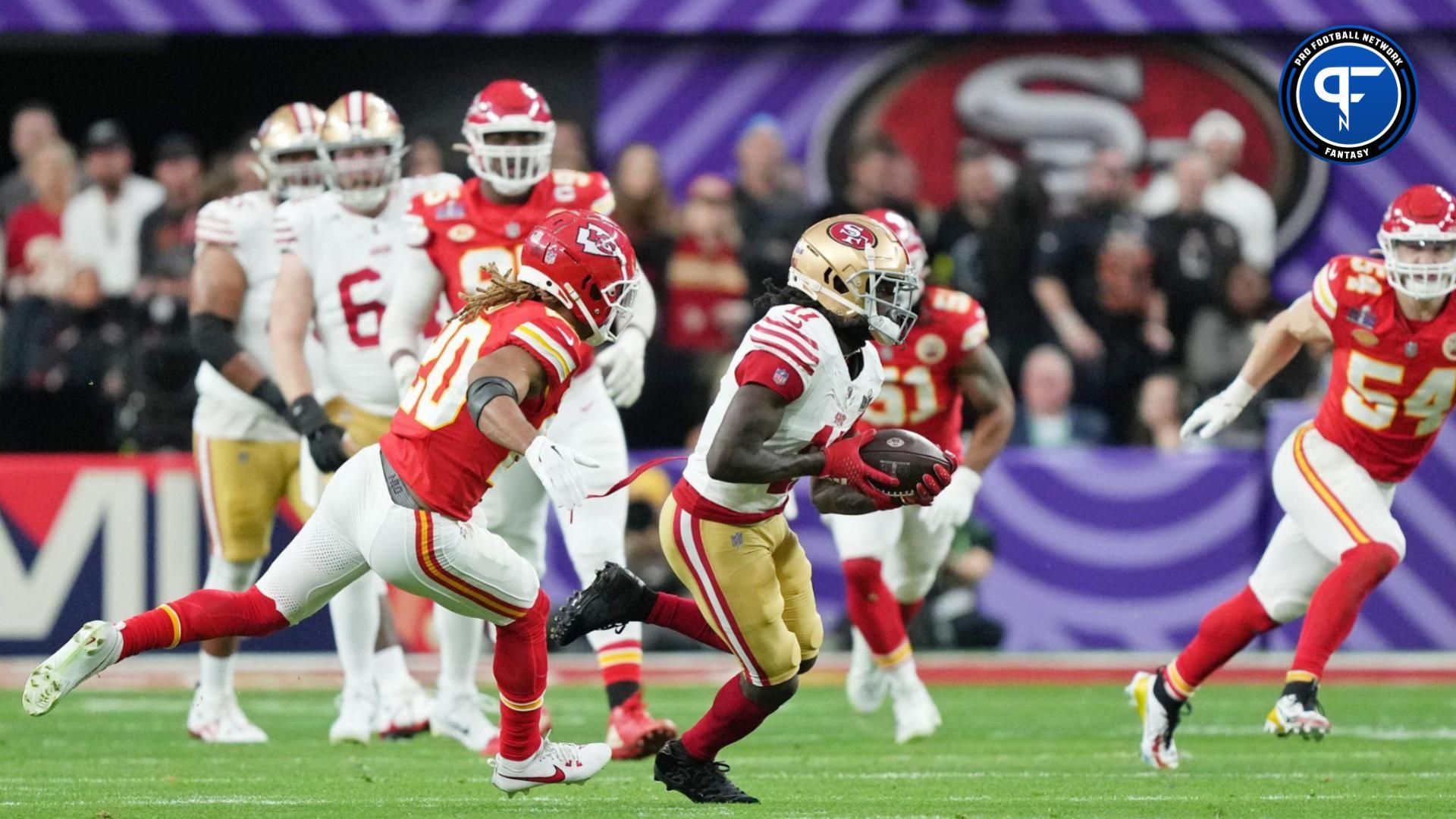 San Francisco 49ers wide receiver Brandon Aiyuk (11) runs with the ball against Kansas City Chiefs safety Justin Reid (20) during the first quarter of Super Bowl LVIII at Allegiant Stadium.