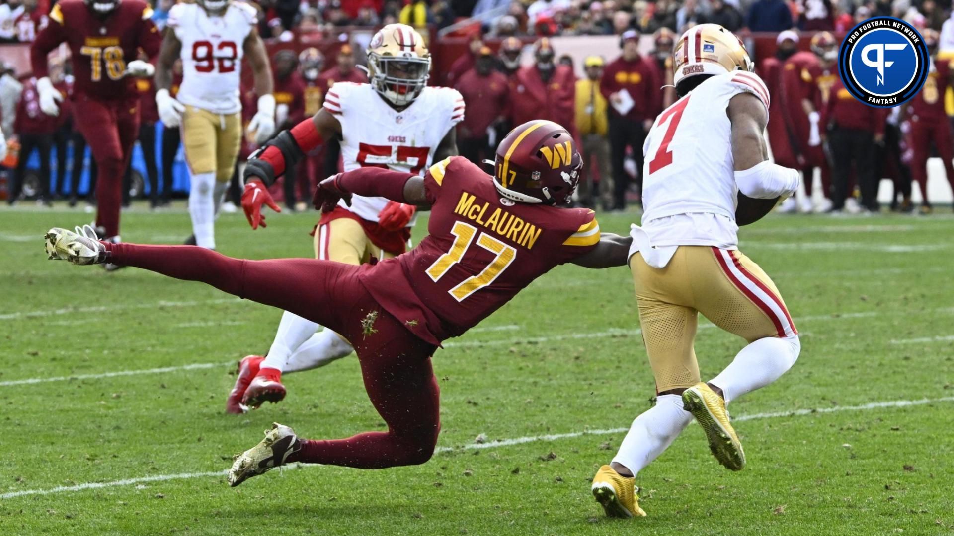 San Francisco 49ers cornerback Charvarius Ward (7) intercepts a pass intended for Washington Commanders wide receiver Terry McLaurin (17) during the second half at FedExField.