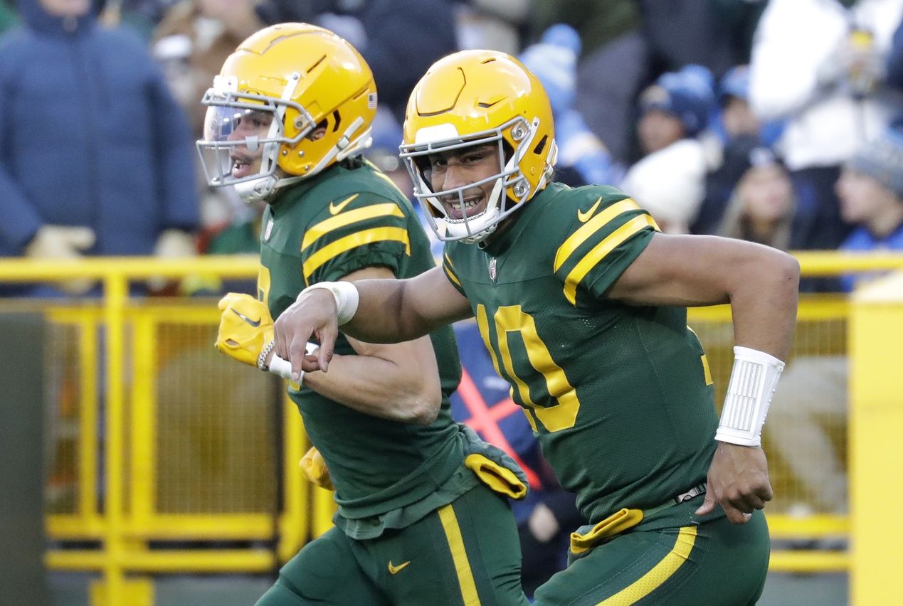 Green Bay Packers quarterback Jordan Love (10) smiles as he runs off the field with wide receiver Christian Watson (9) after the two connected on a touchdown pass against the Los Angeles Chargers at Lambeau Field. Mandatory Credit: Dan Powers-USA TODAY Sports