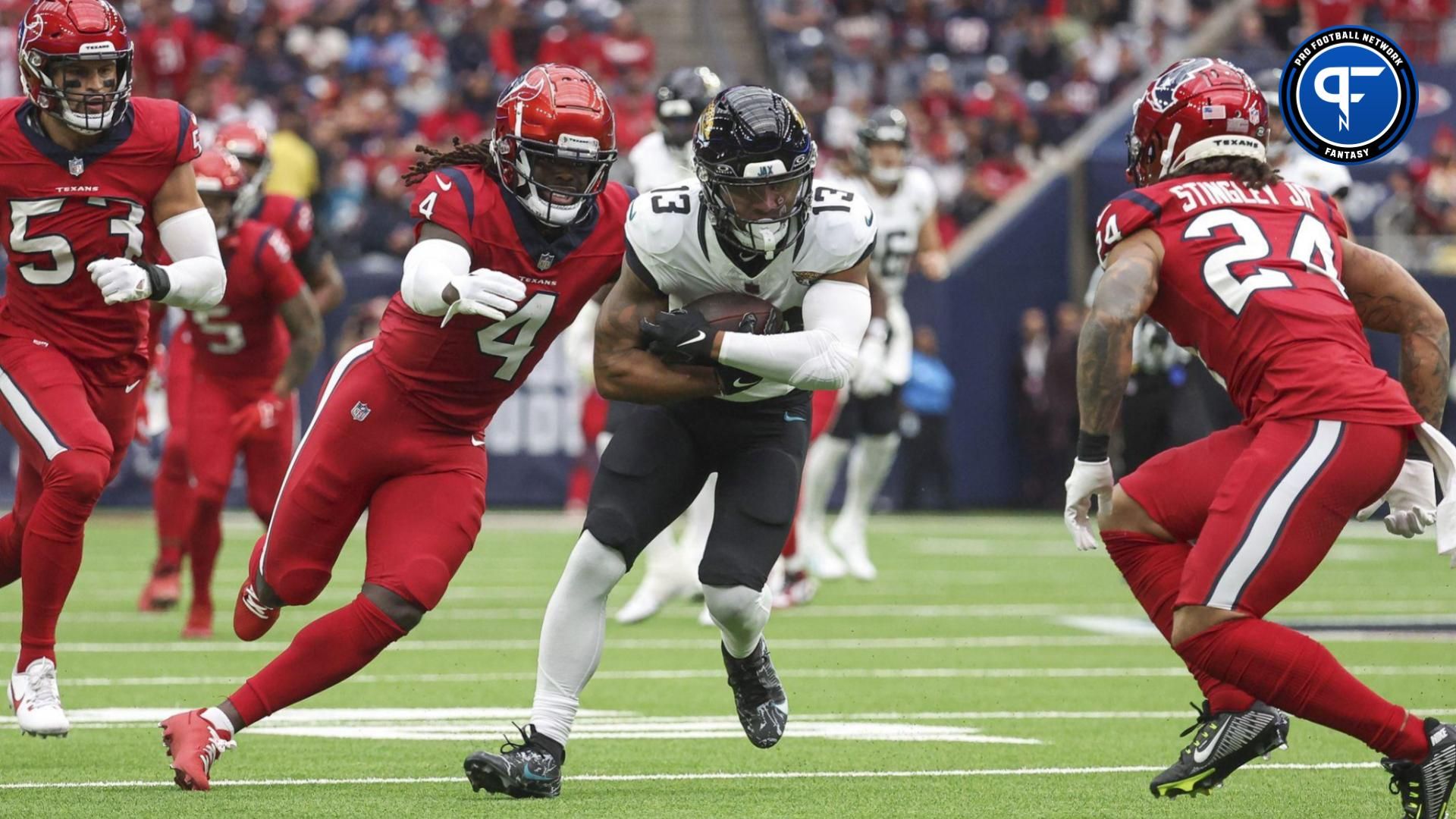 Jacksonville Jaguars wide receiver Christian Kirk (13) runs with the ball after a reception as Houston Texans cornerback Tavierre Thomas (4) attempts to make a tackle during the first quarter at NRG Stadium.