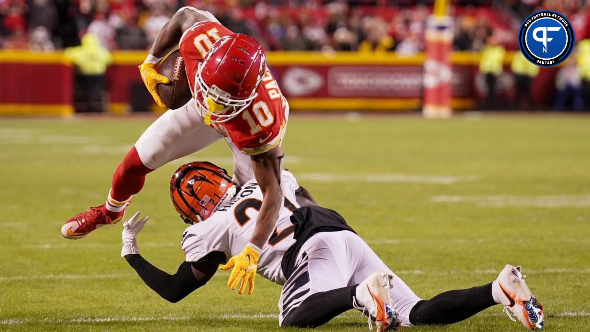 Kansas City Chiefs running back Isiah Pacheco (10) runs the ball as Cincinnati Bengals cornerback Mike Hilton (21) makes the tackle during the second half at GEHA Field at Arrowhead Stadium. Where does he land in our fantasy rankings?