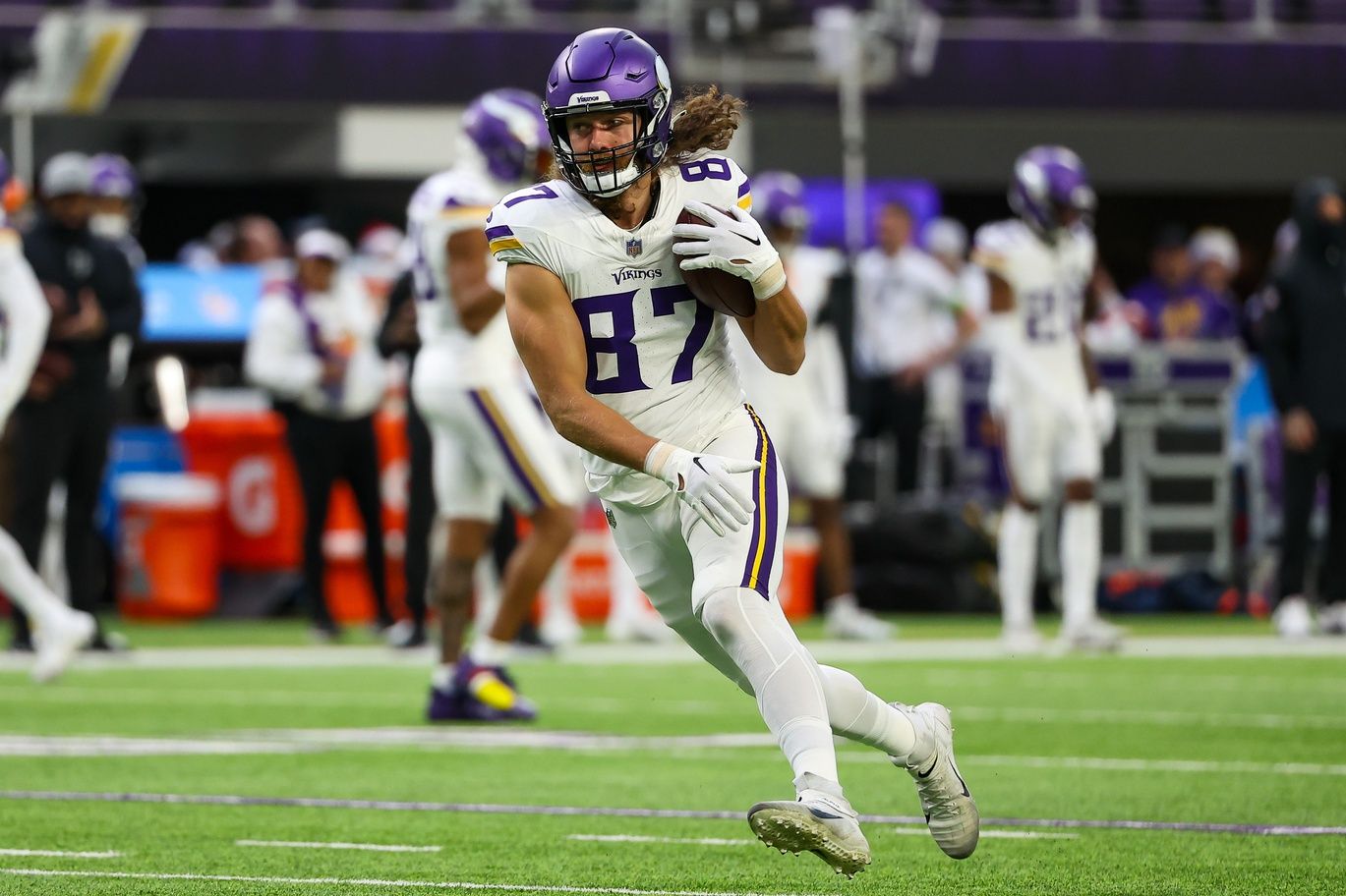 Minnesota Vikings TE T.J. Hockenson (87) runs after the catch.