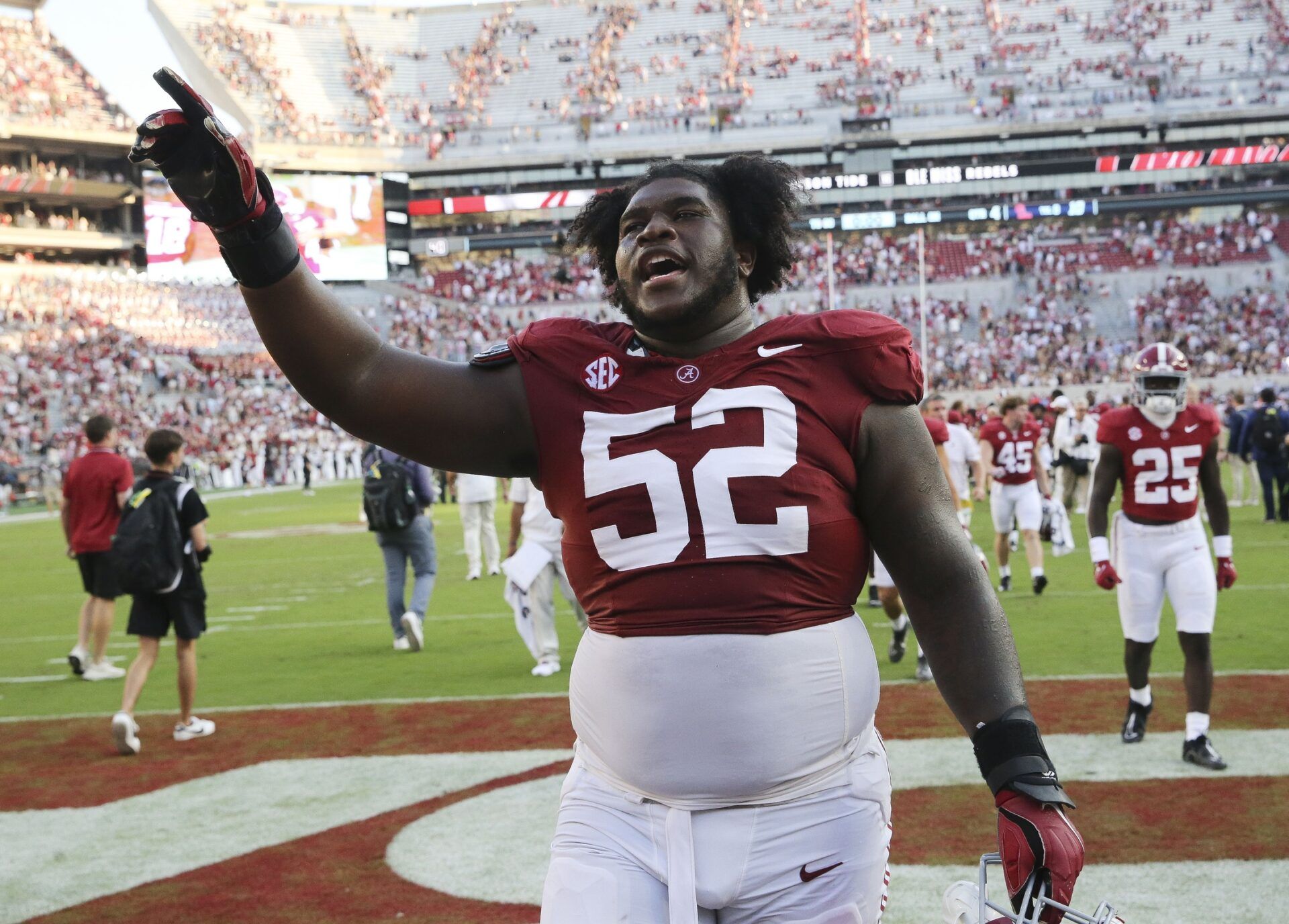 Alabama Crimson Tide offensive lineman Tyler Booker (52) celebrates as he leaves the field at Bryant-Denny Stadium. Alabama defeated Mississippi 24-10. Booker lands in Cincinnati in our latest Bengals mock draft. Mandatory Credit: Gary Cosby Jr.-USA TODAY Sports