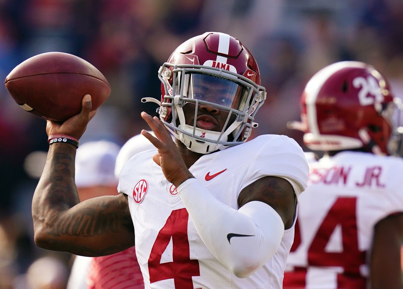 Alabama Crimson Tide quarterback Jalen Milroe (4) runs through passing drills during pregame warmups before their game against the Auburn Tigers at Jordan-Hare Stadium. Milroe lands in Cleveland in our lates Browns mock draft. Mandatory Credit: John David Mercer-USA TODAY Sports